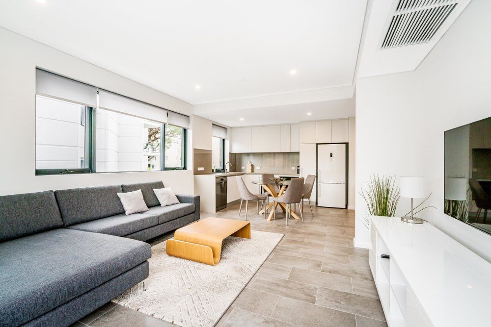 A Living Room with A Couch, Table, and Television — Cachia Upholstery in Nabiac, NSW