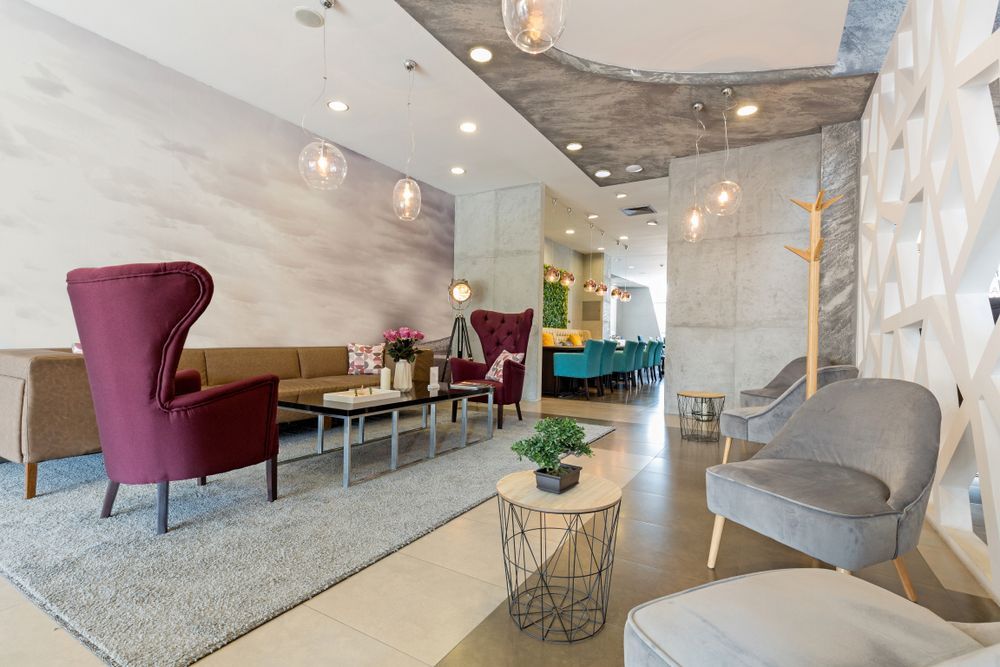 Modern Hotel Lobby With Pink and Gray Chairs — Cachia Upholstery in Forster, NSW