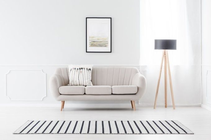 Living Room with A Couch, Lamp, Rug and Picture on The Wall — Cachia Upholstery in Tuncurry, NSW