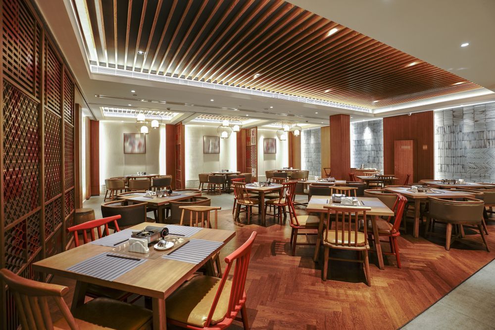 Elegant Restaurant Dining Room With Wooden Tables — Cachia Upholstery in Tuncurry, NSW