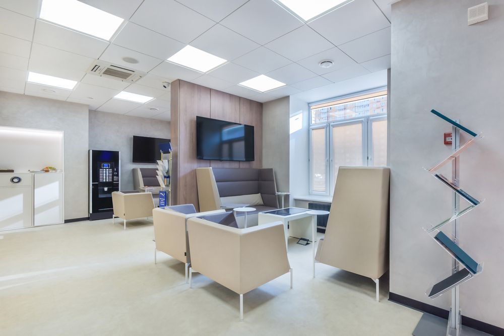 Modern Office Lounge With White Chairs — Cachia Upholstery in Taree, NSW