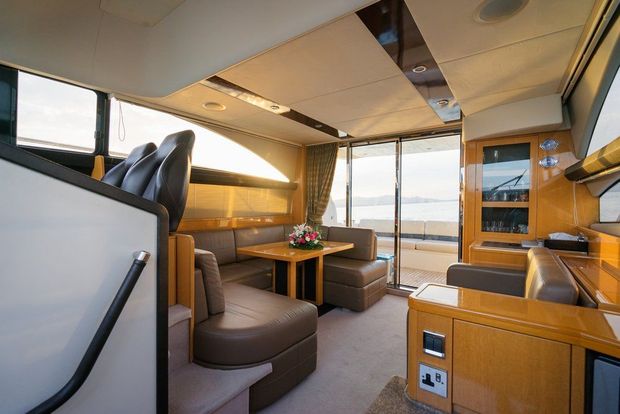 Living Room on A Boat with A Table and Chairs — Cachia Upholstery in Tuncurry, NSW