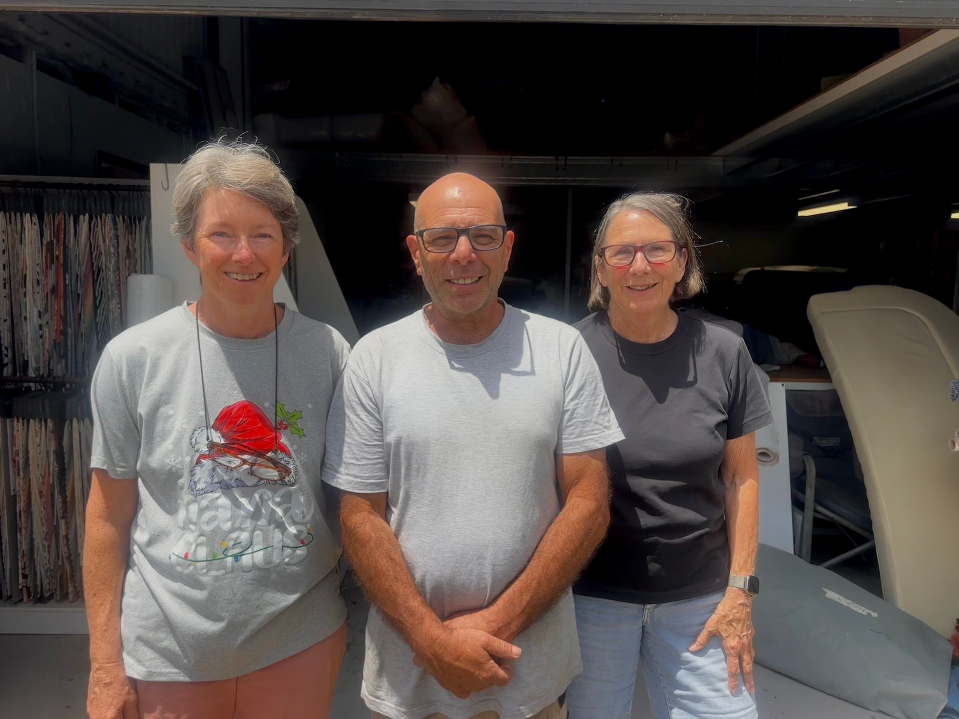 A Living Room with A Couch, Chairs, a Rug and A Clock on The Wall — Cachia Upholstery in Tuncurry, NSW