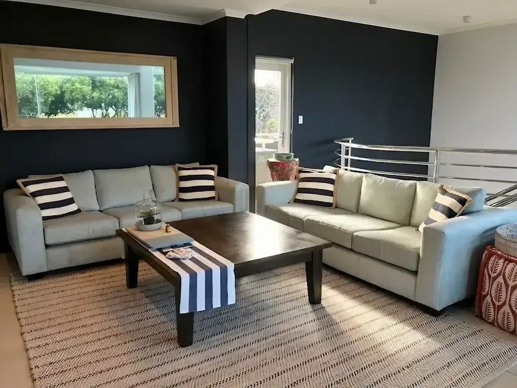 A Living Room with Two Couches and A Coffee Table — Cachia Upholstery in Taree, NSW