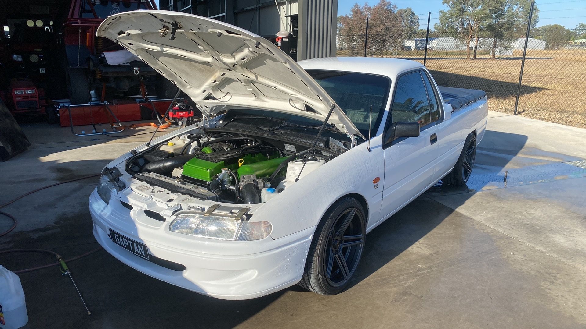 White car with Bonnet raised outside garage — NG Mechanical Services in Thurgoona, NSW