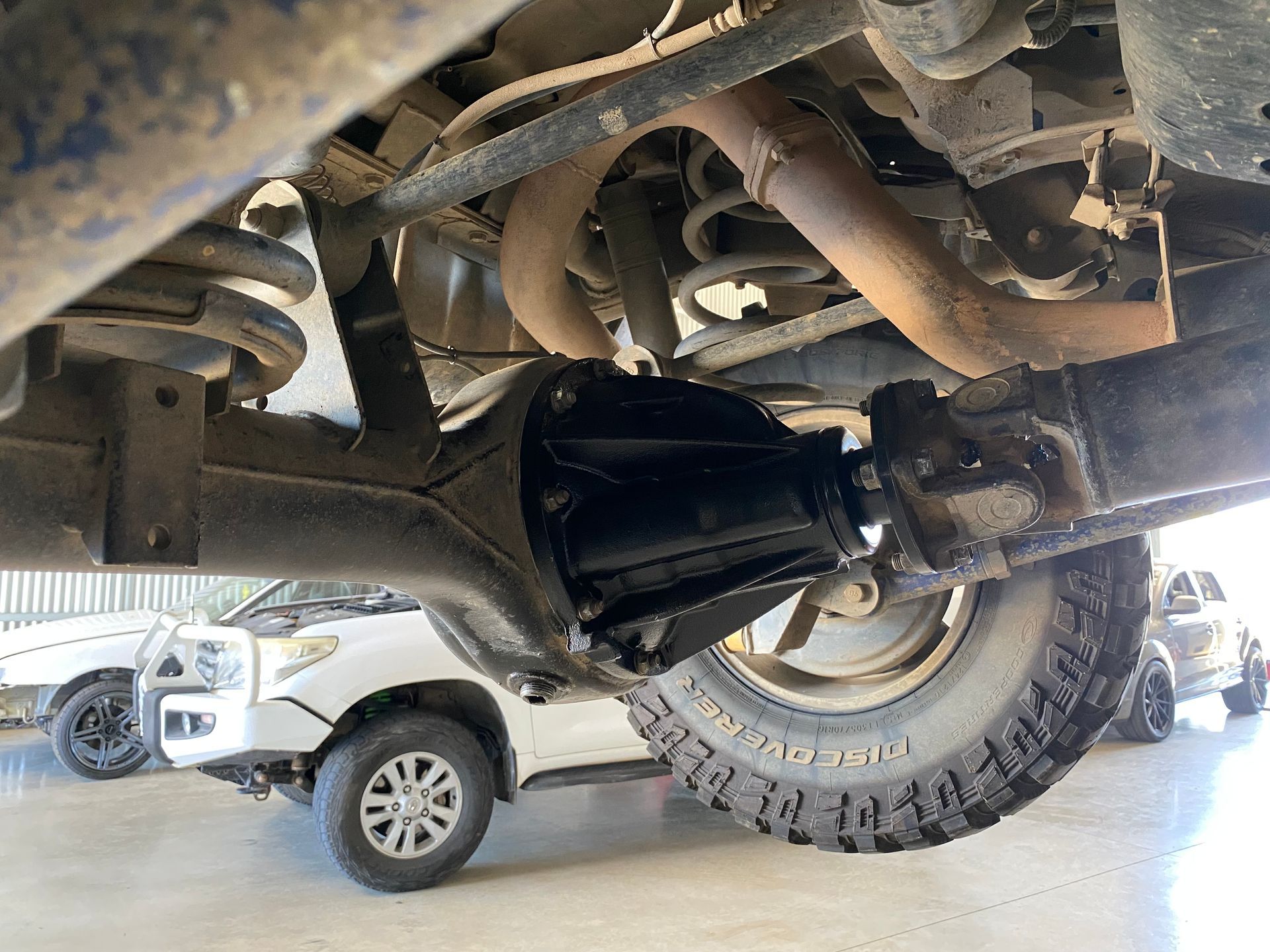 4WD car raised to get work on bottom of car — NG Mechanical Services in Thurgoona, NSW