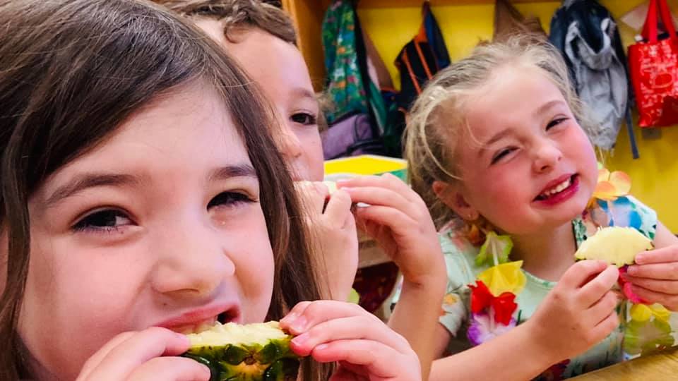 Kids Eating A Pineapple — Dover, NH — Children In Motion