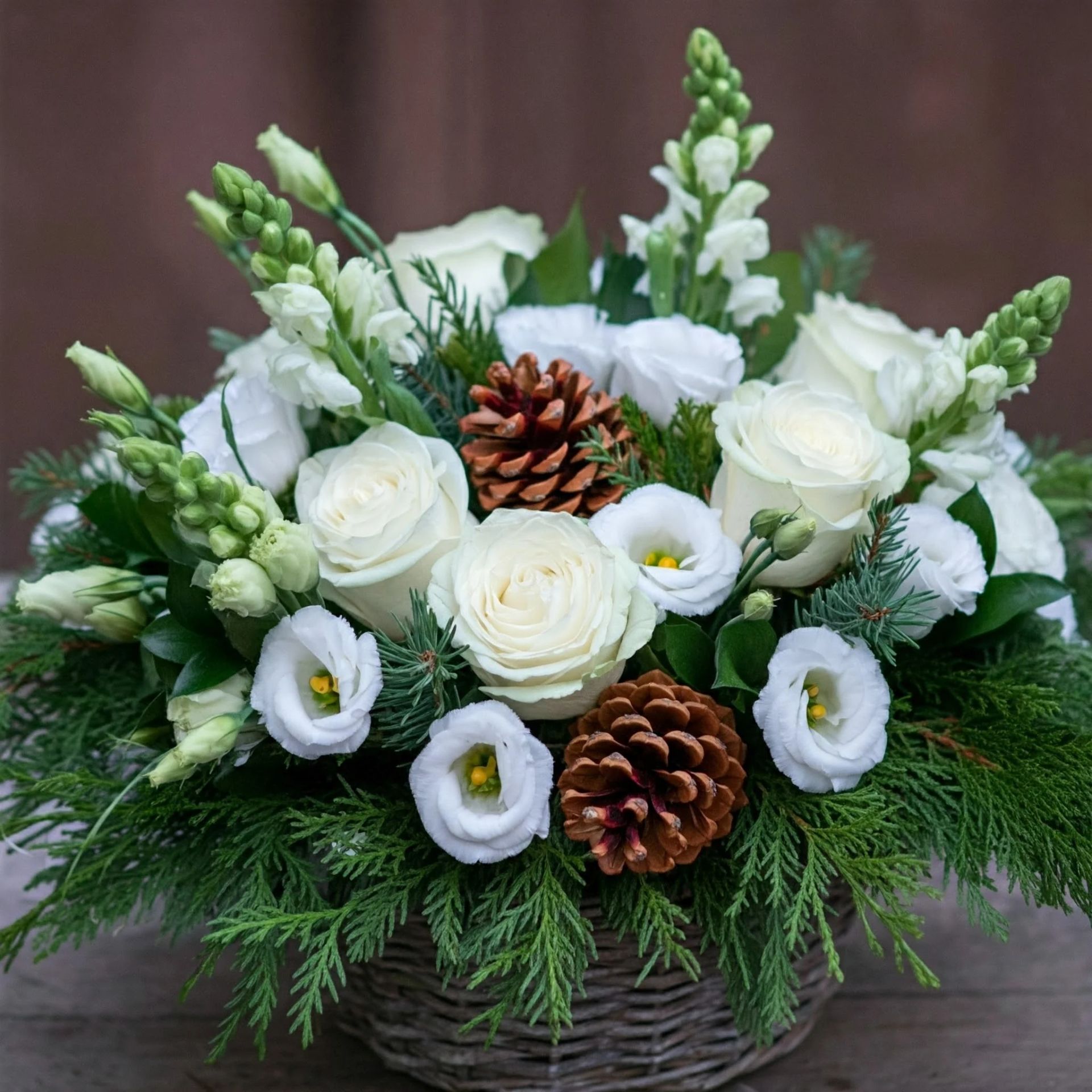 a vase filled with red and white flowers on a table