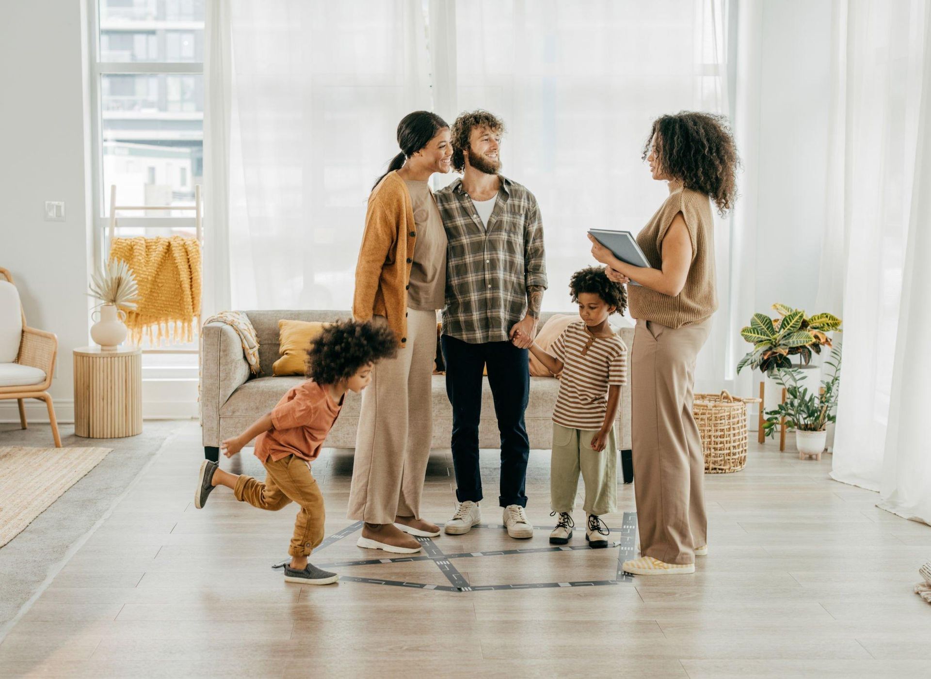 A family is playing a game in a living room.