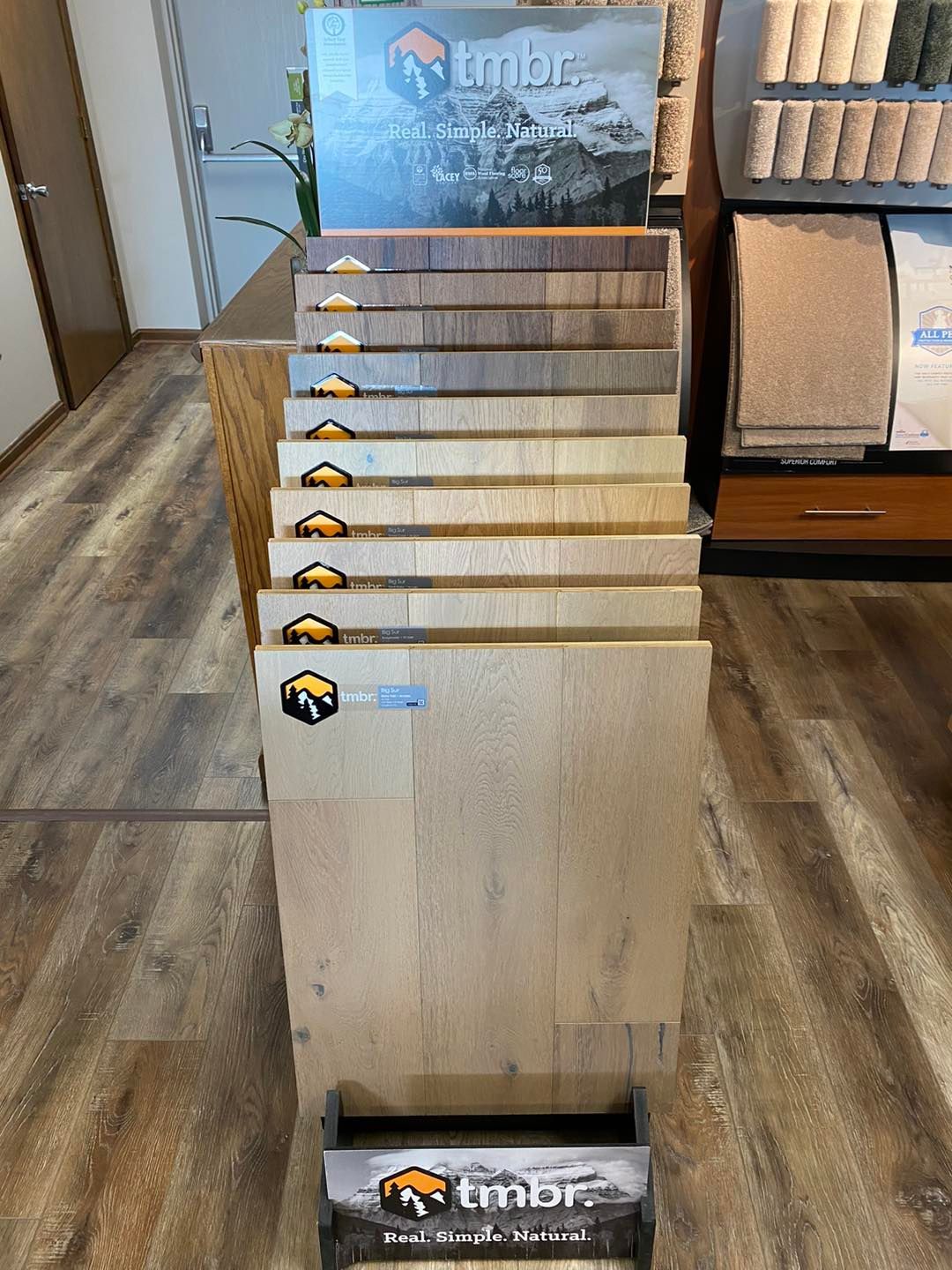 A display of wooden flooring samples in a store.