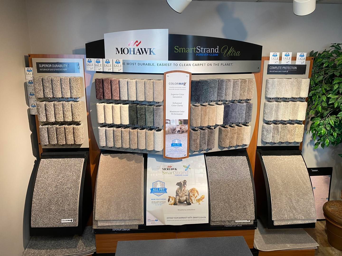 A display of different types of carpets in a store