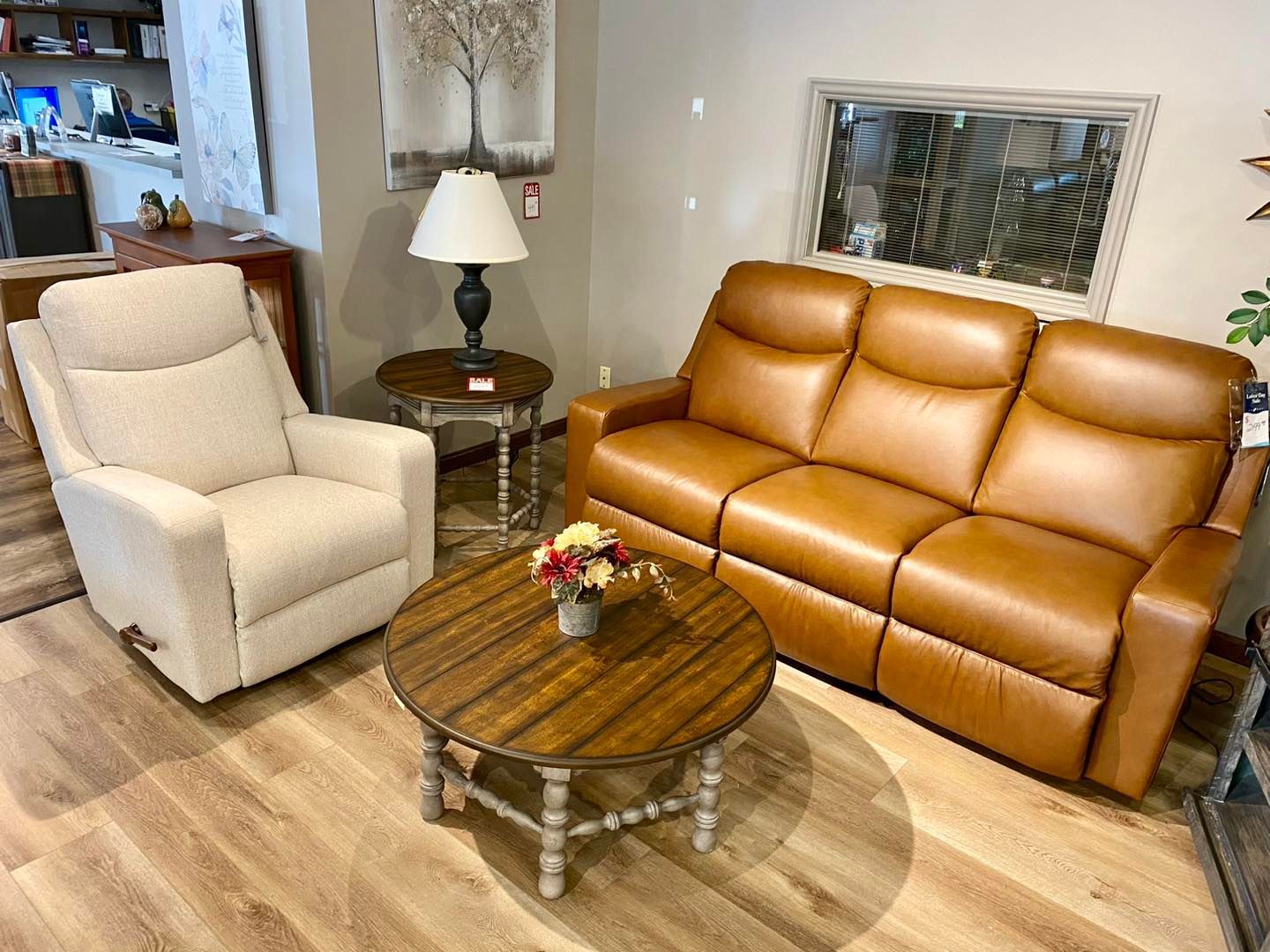 A living room with a couch , chair , and coffee table.