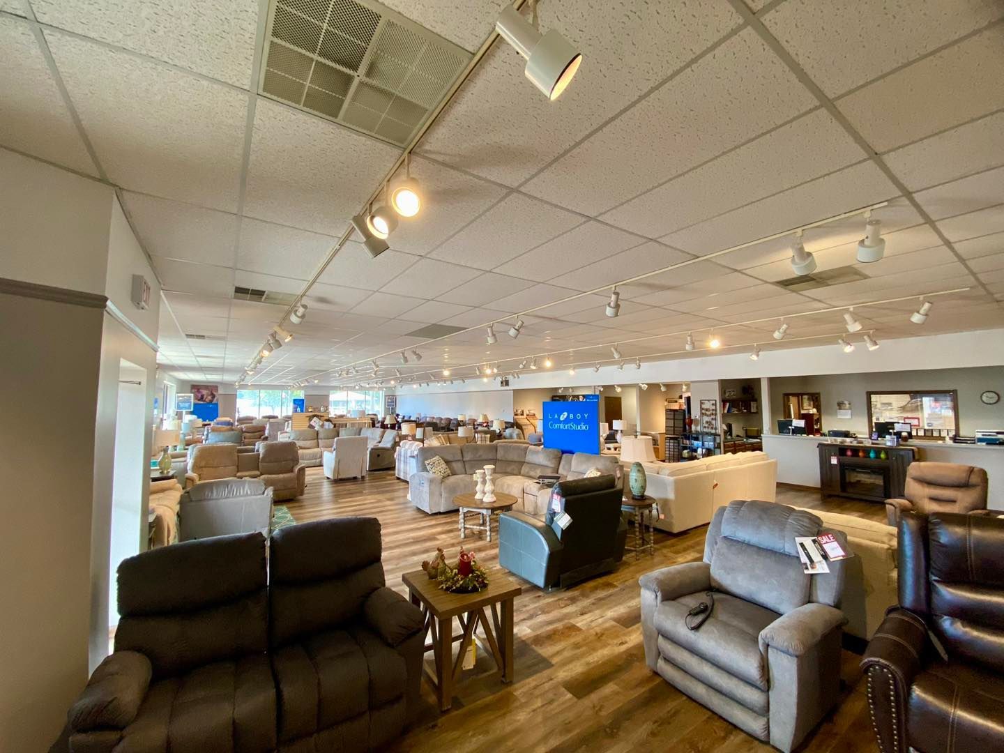 A large living room filled with furniture and a couch.