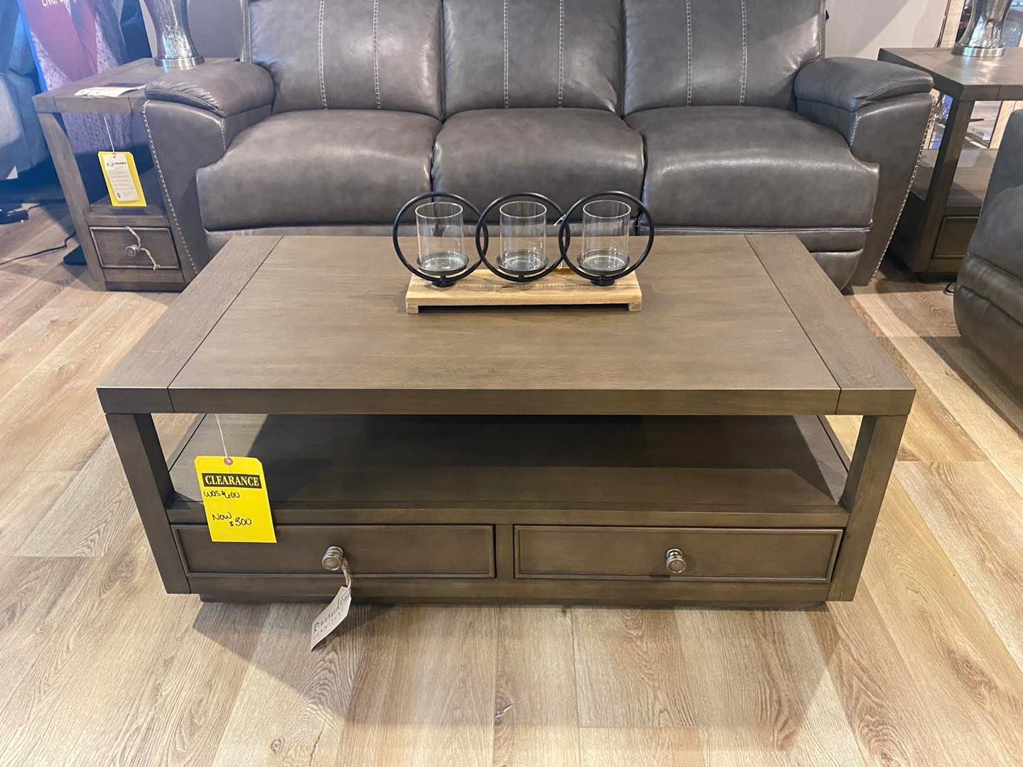 A coffee table is sitting in front of a couch in a living room.