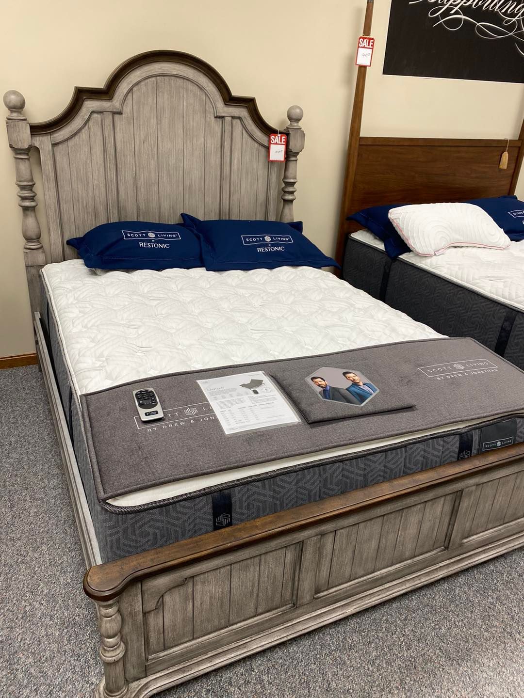A bed with a mattress on top of it in a store.