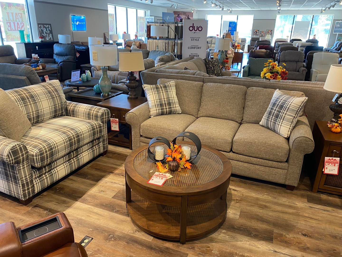 A living room filled with furniture and a round coffee table.