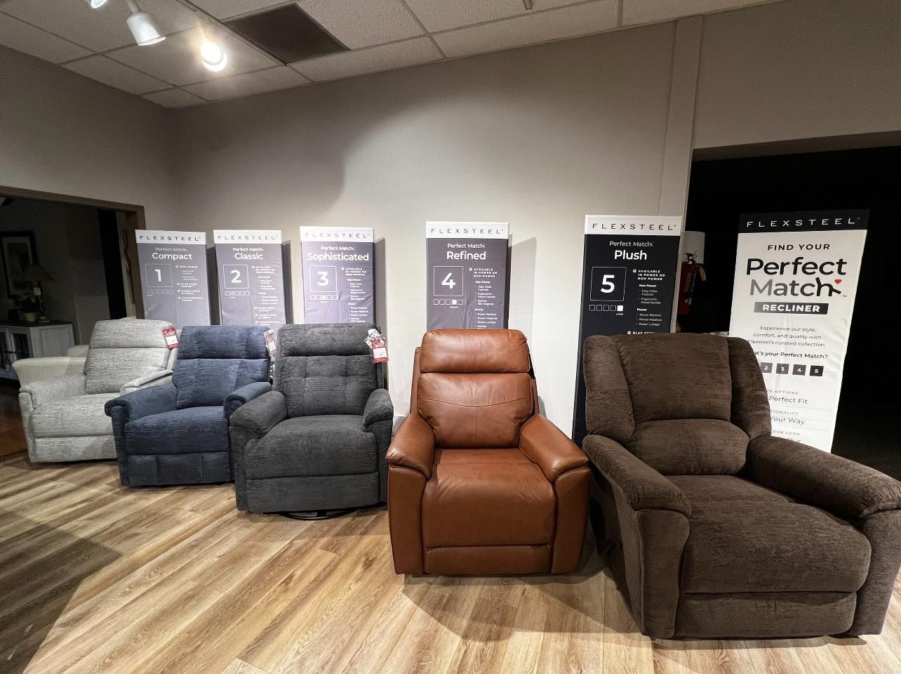 A row of recliner chairs are lined up in a room.