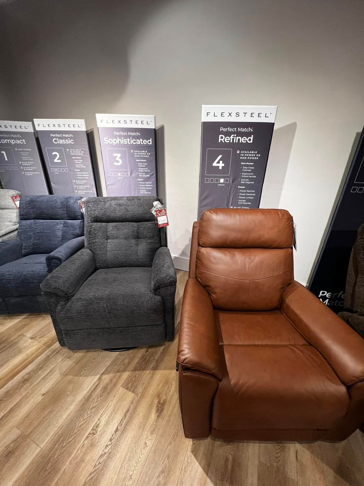 A group of recliner chairs are sitting next to each other in a room.