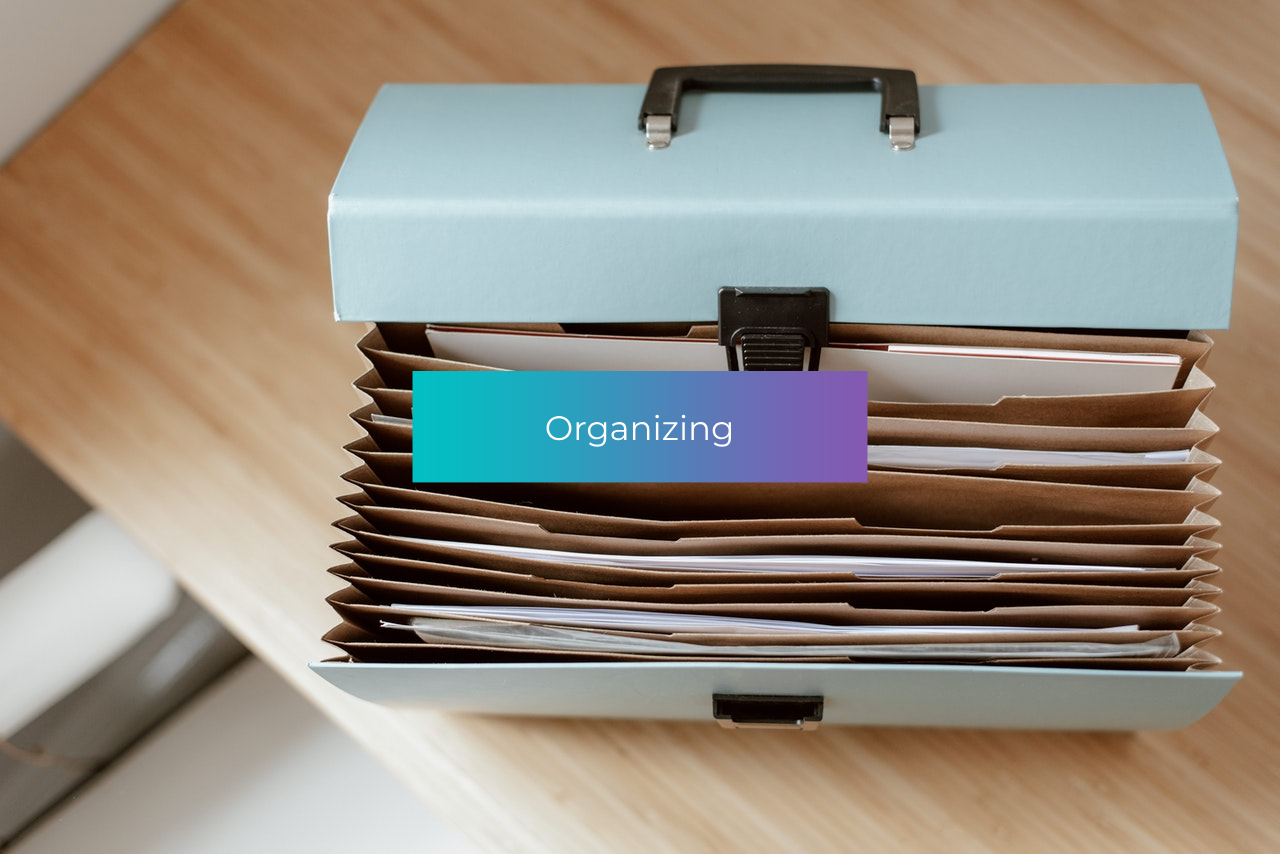 A briefcase filled with papers and a label that says organizing