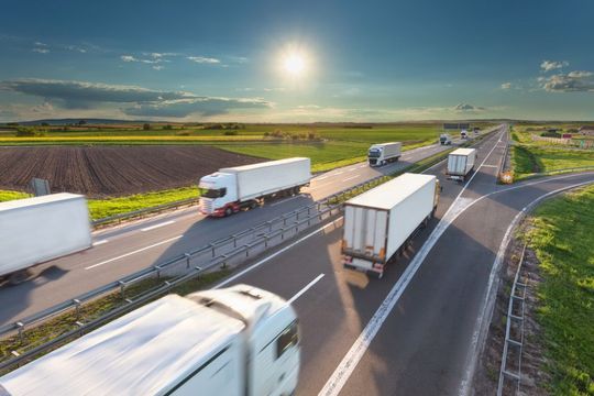 Number of delivery trucks driving through roads