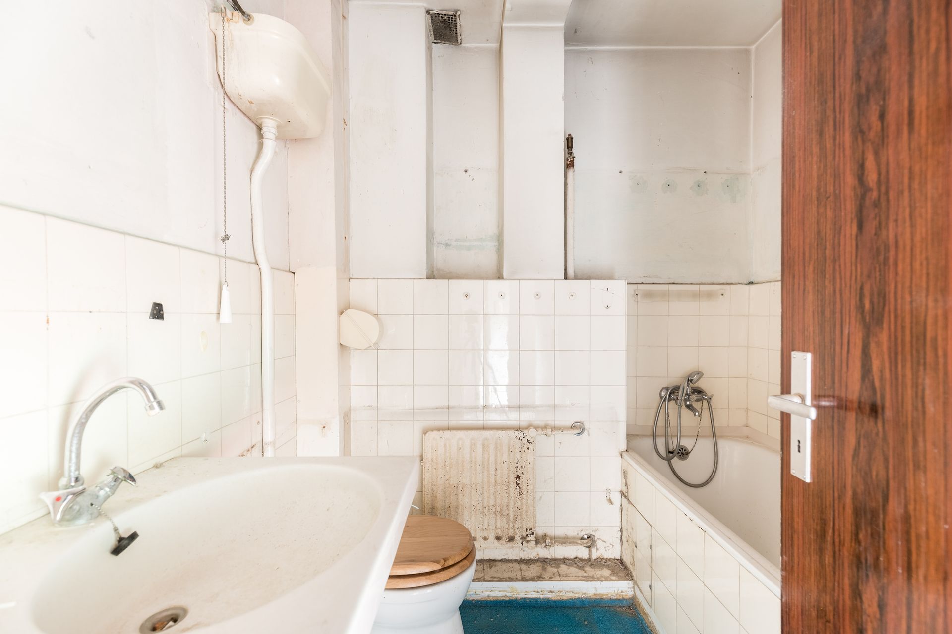 A bathroom with a sink , toilet , bathtub and shower.