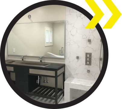 A bathroom with a sink and a large mirror