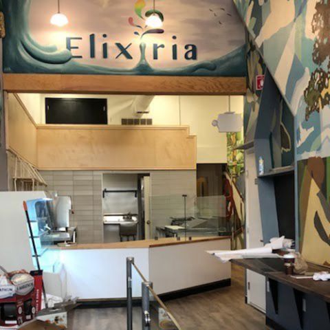 A restaurant with a sign that says elixiria