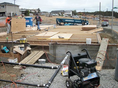 A construction site with a truck that says ebaralic on it