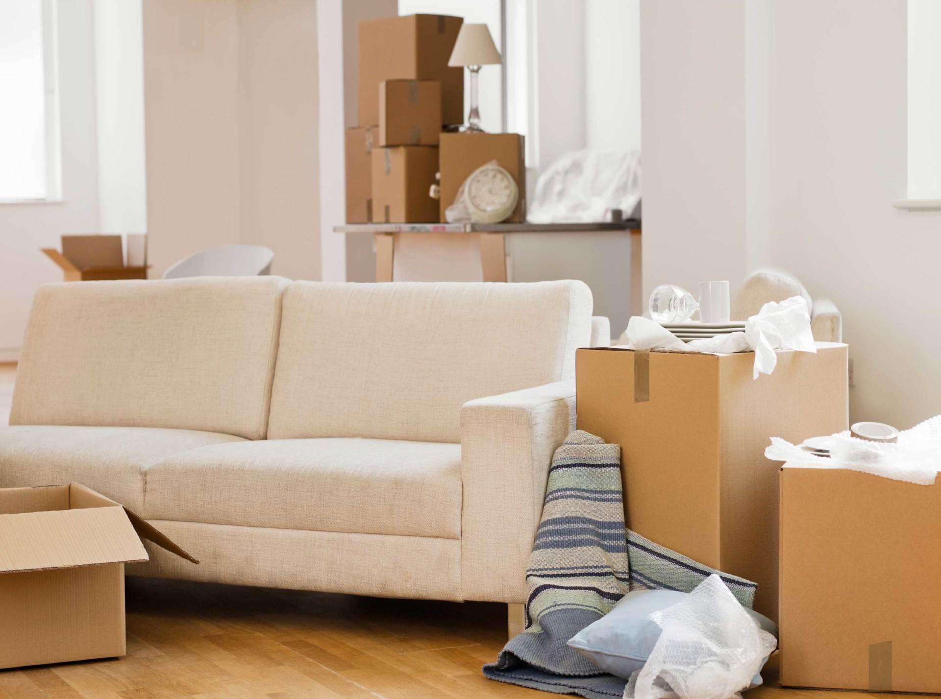 Living room with packed moving boxes