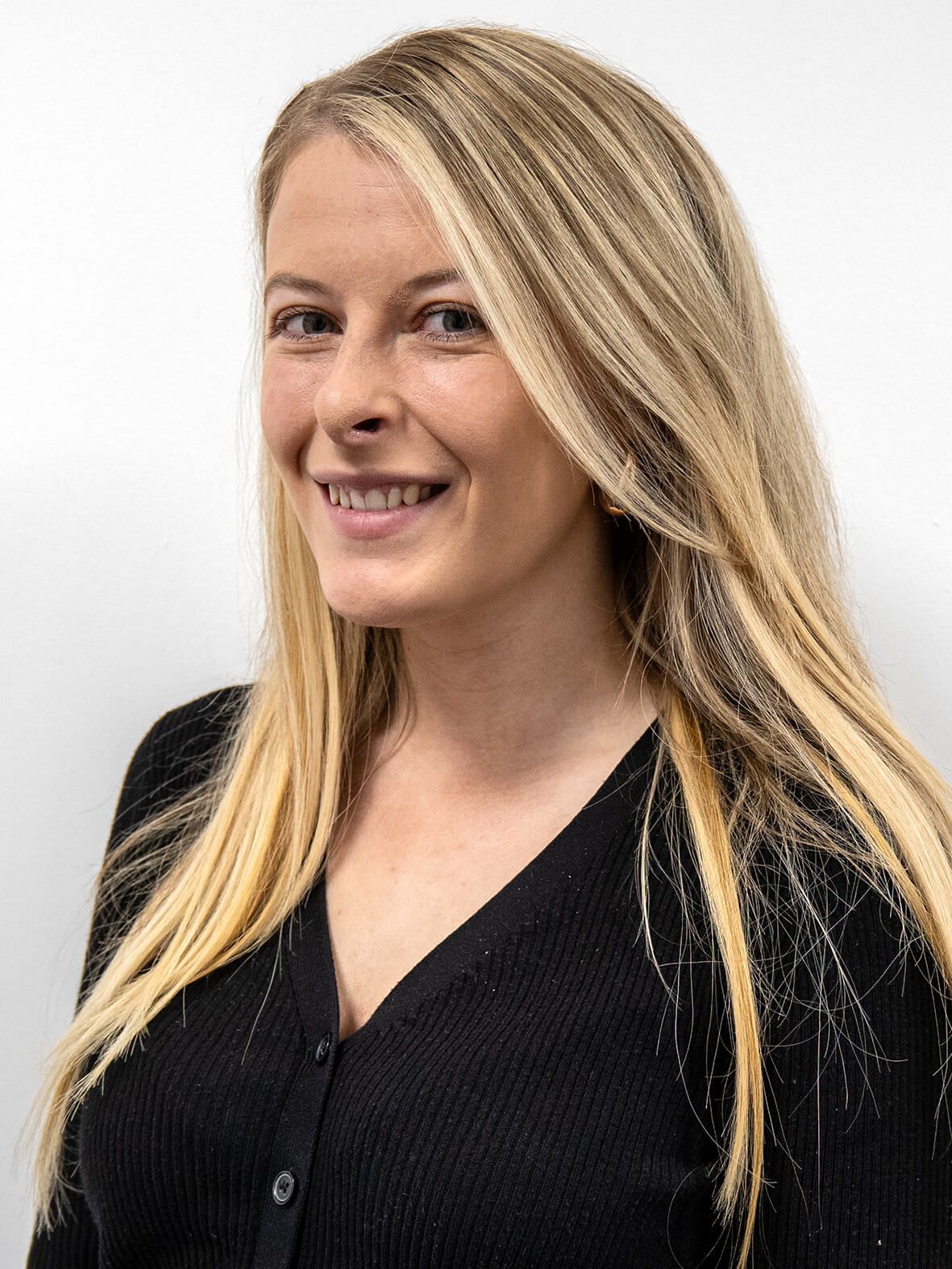 A purple icon of a person on a gray background.