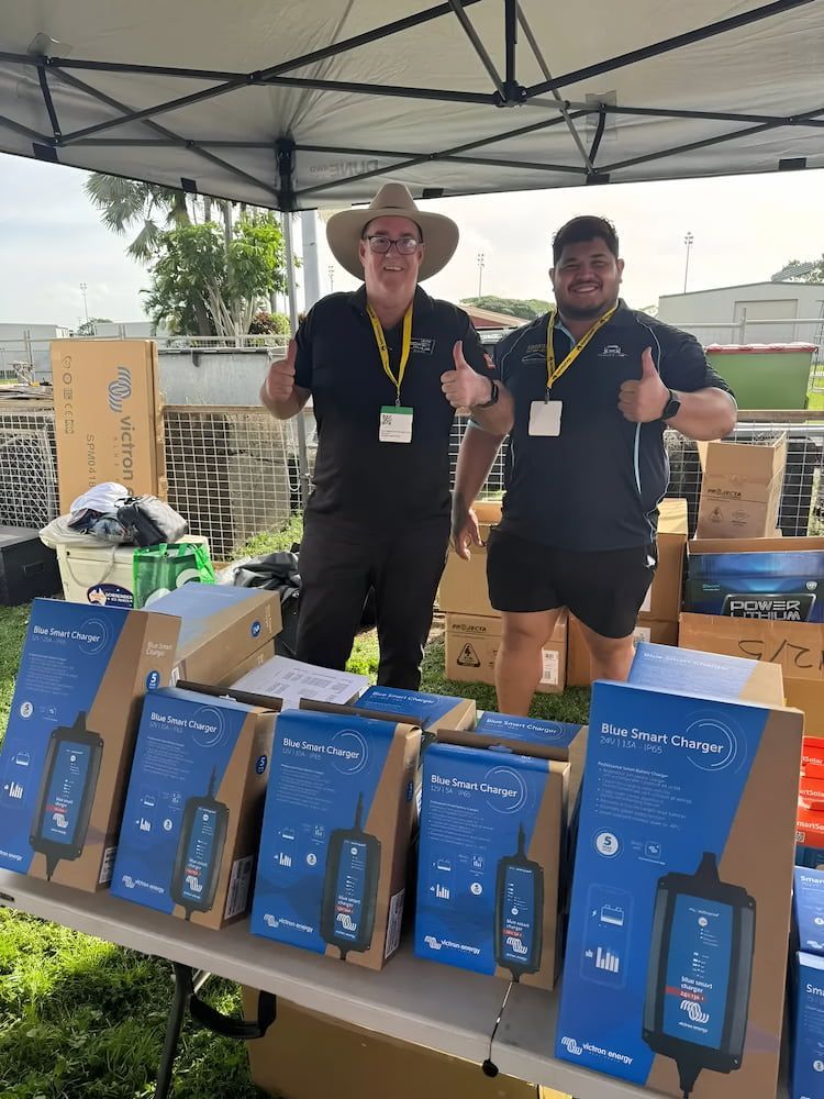 Two Men at a Booth With Blue-boxed Chargers — Edmonton Battery Centre in Bentley Park, QLD
