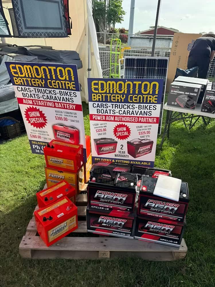 Edmonton Battery Centre Display: Car Batteries on a Pallet With Signs — Edmonton Battery Centre in Bentley Park, QLD