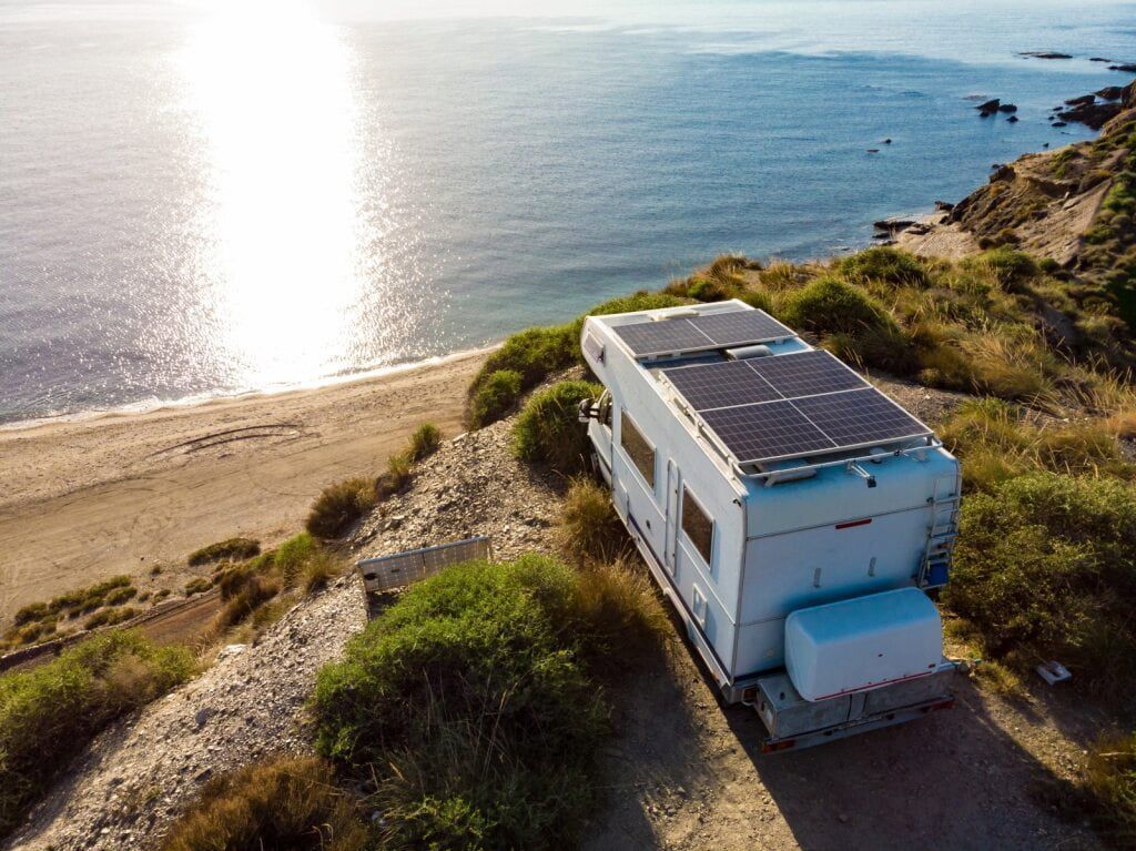 RV Parked on a Cliff Overlooking the Ocean With Solar Panels on the Roof — Edmonton Battery Centre in Bentley Park, QLD