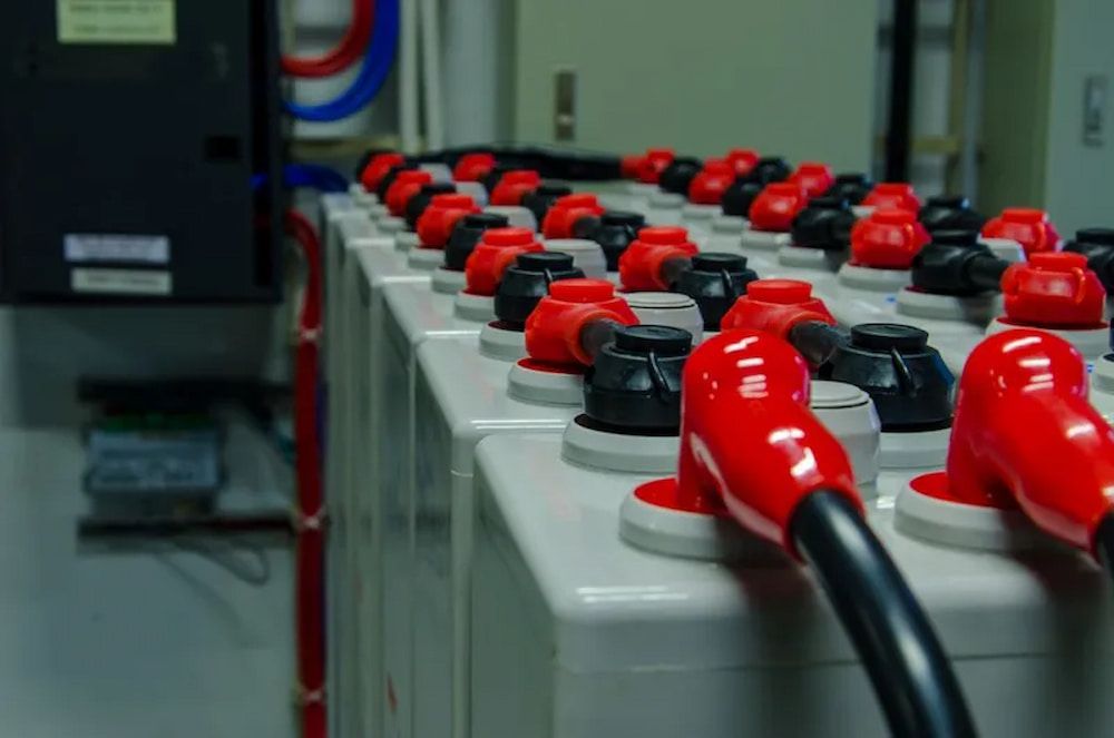 Rows of Industrial Batteries With Red and Black Terminals in a Utility Room — Edmonton Battery Centre in Bentley Park, QLD