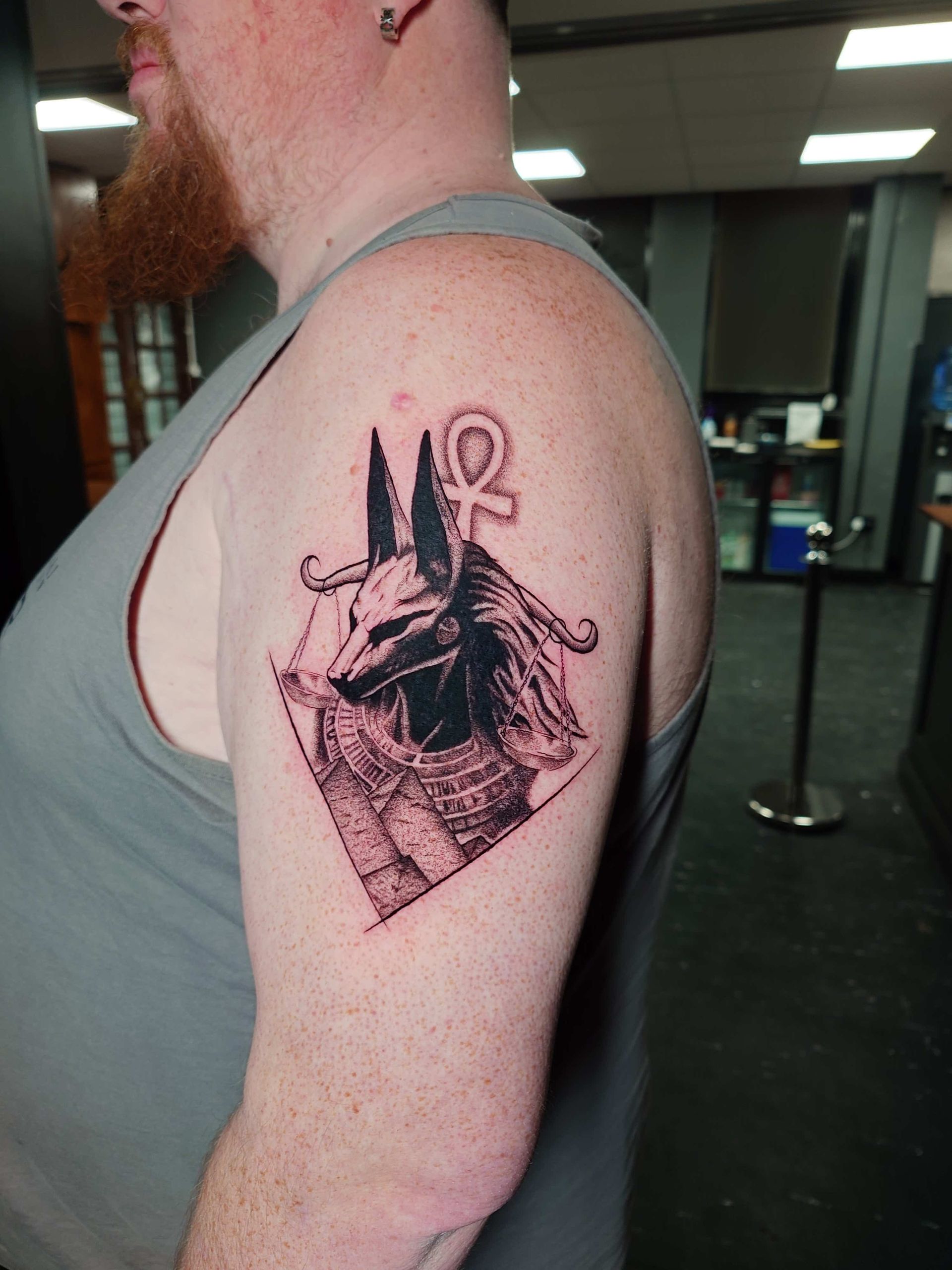 A tattoo of a pikachu and a light bulb on a person 's arm