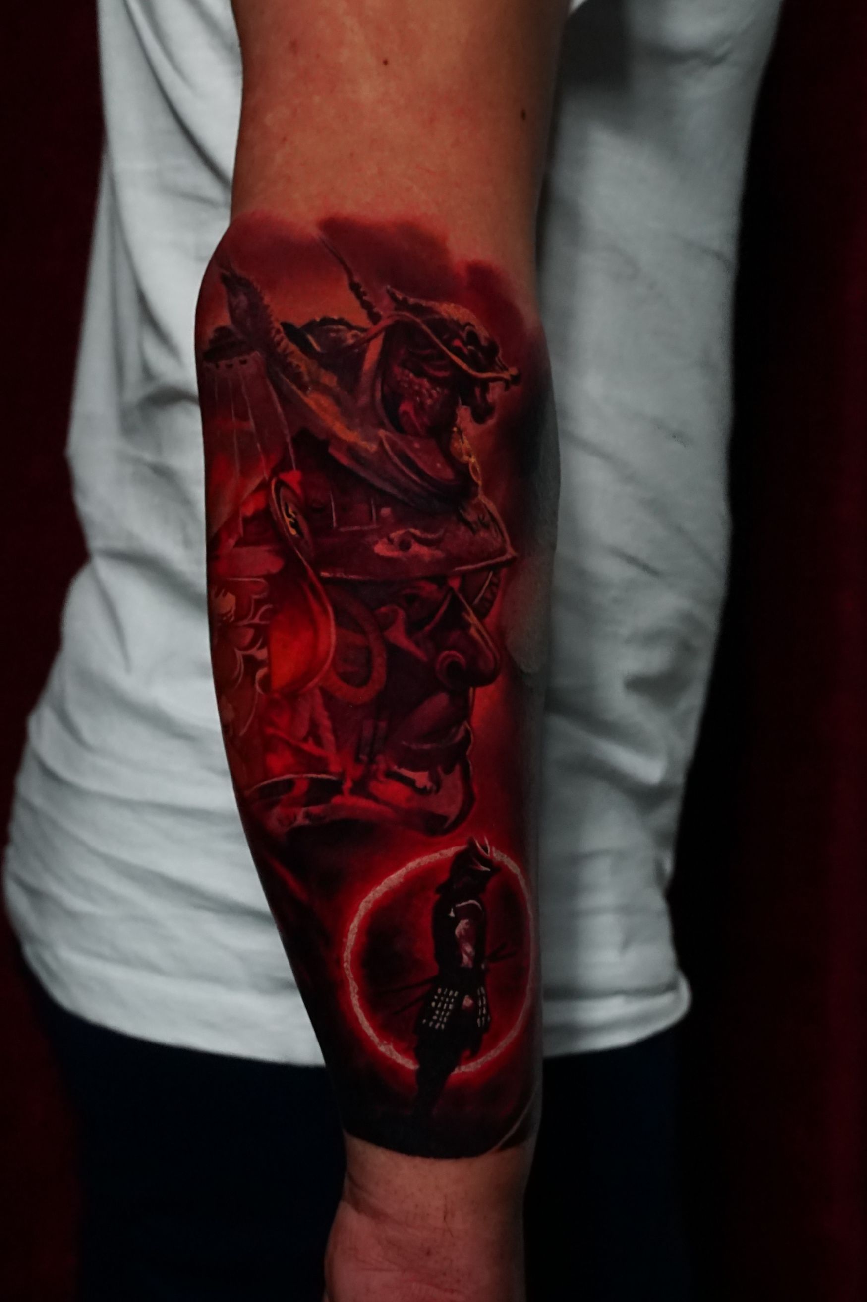 A person with a tattoo on their arm that looks like a painting