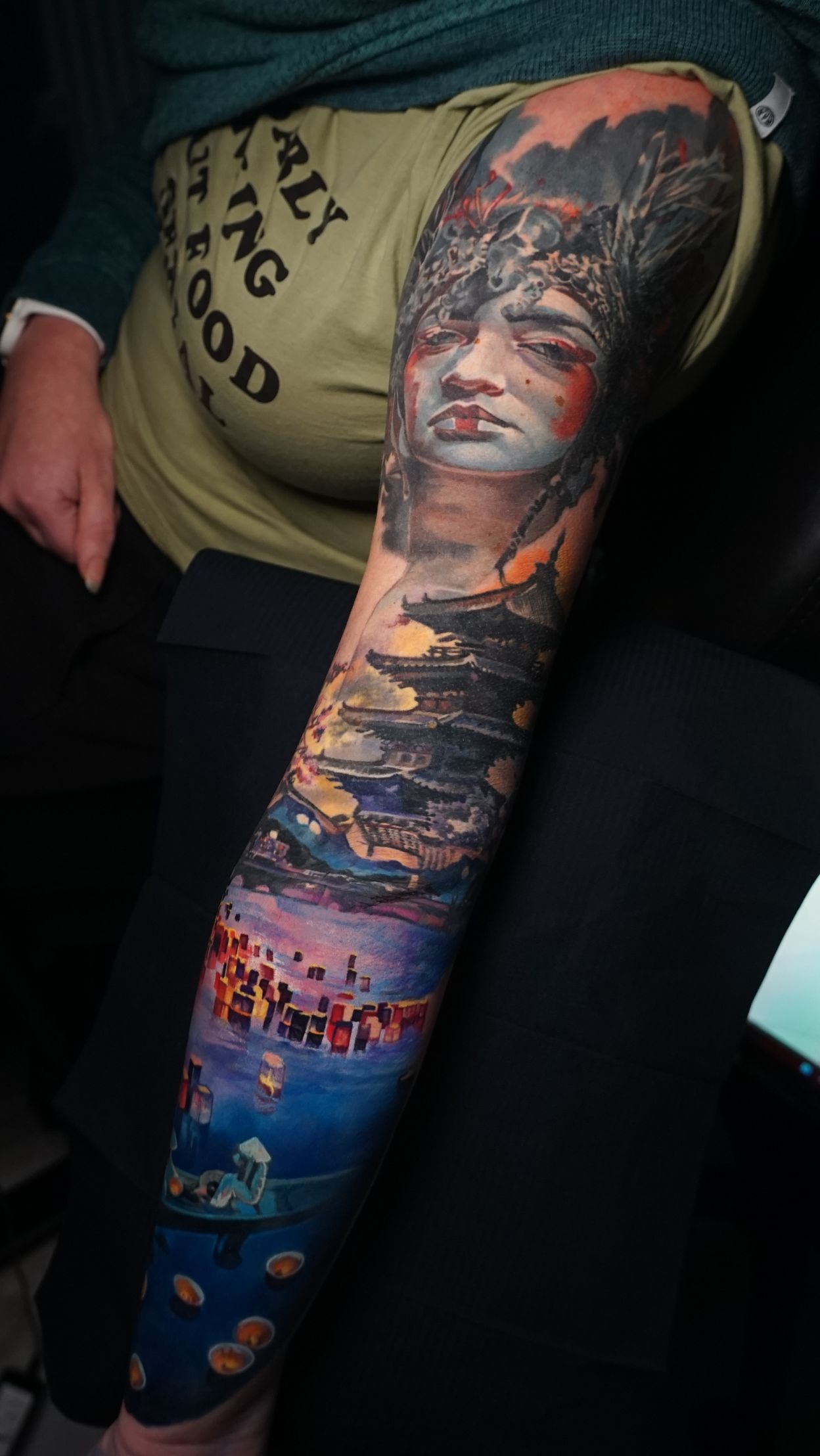 A person with a tattoo on their leg that looks like a painting.