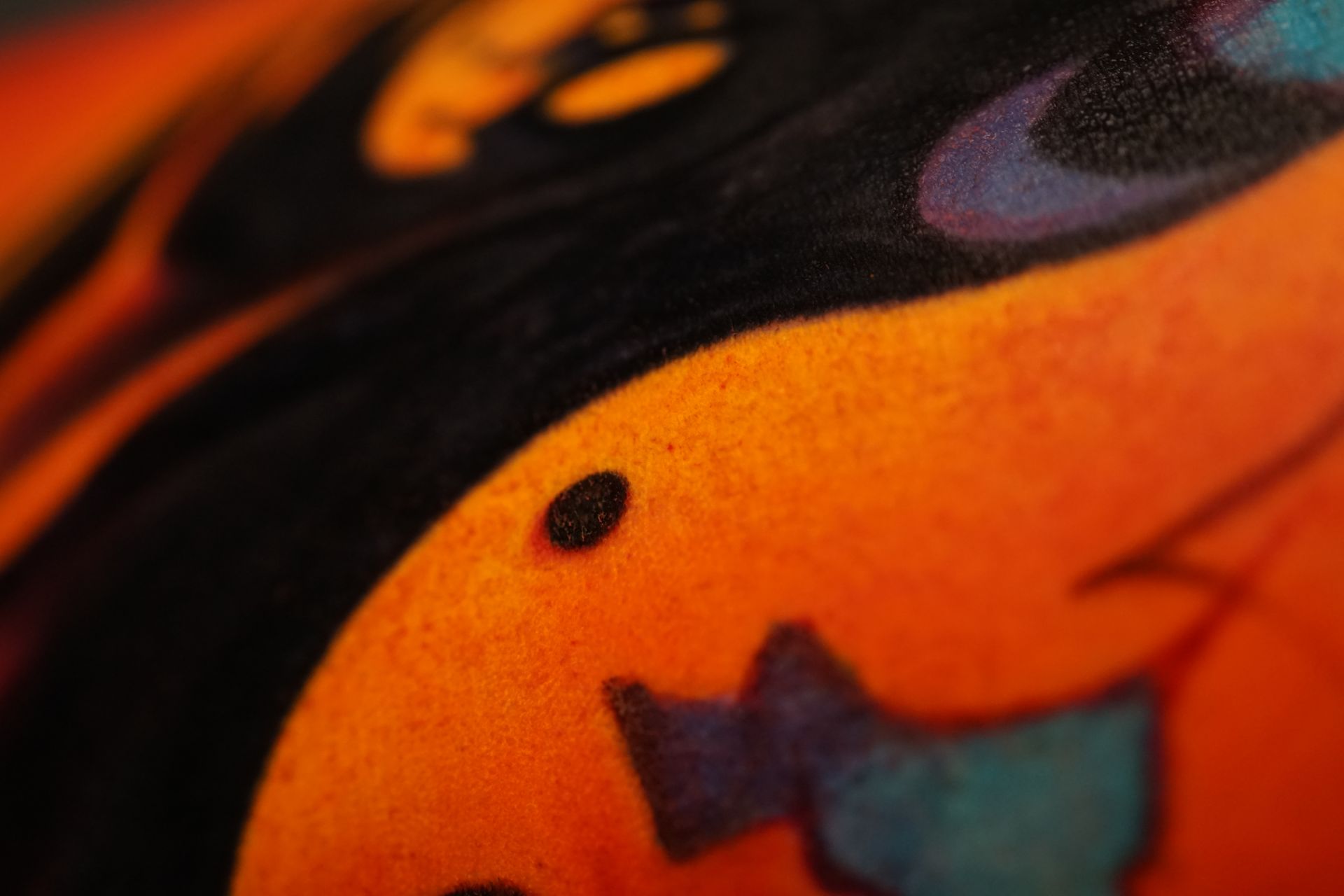 A close up of a pumpkin with a tattoo on it