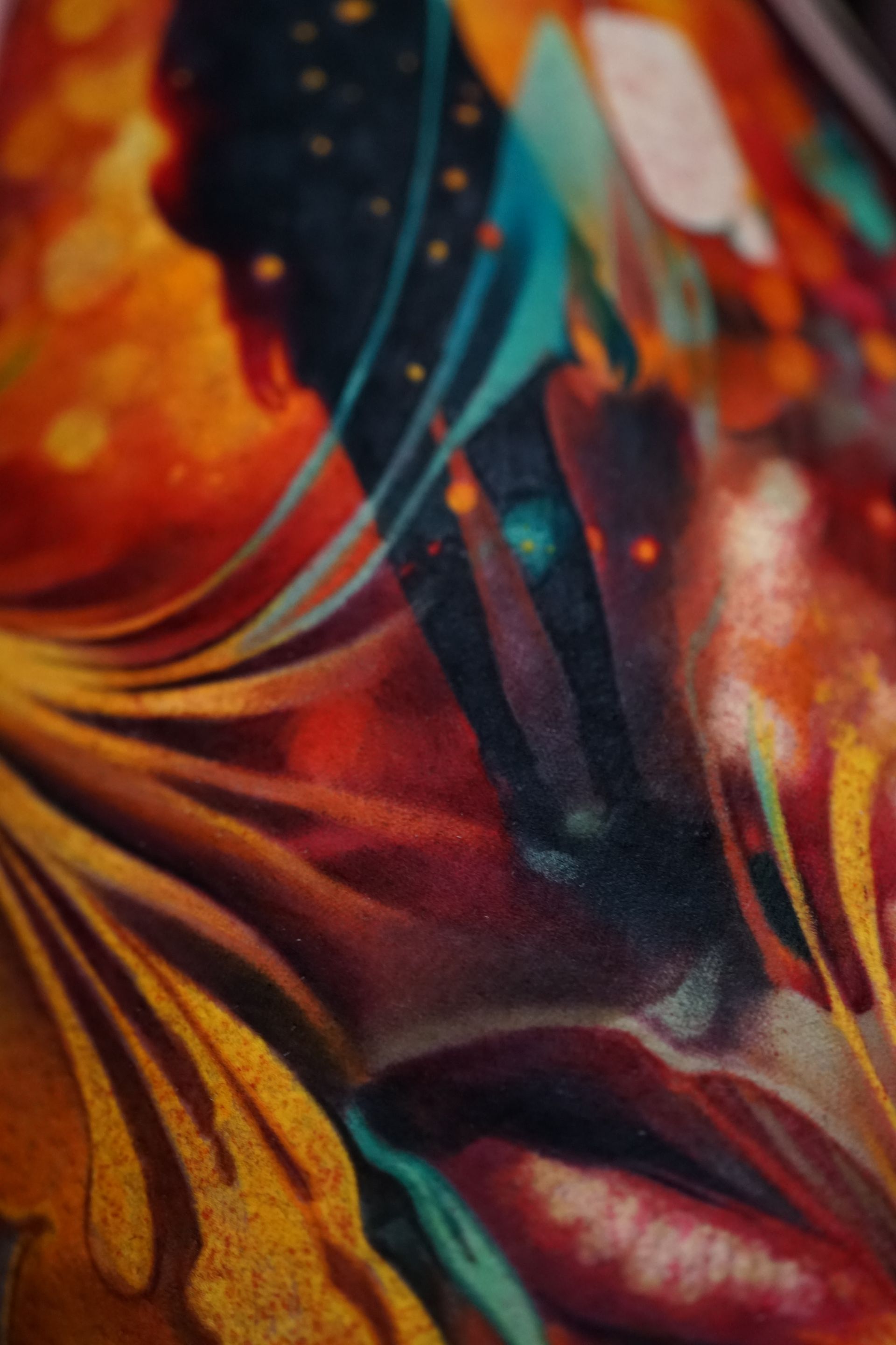 A close up of a colorful painting of a woman 's face.