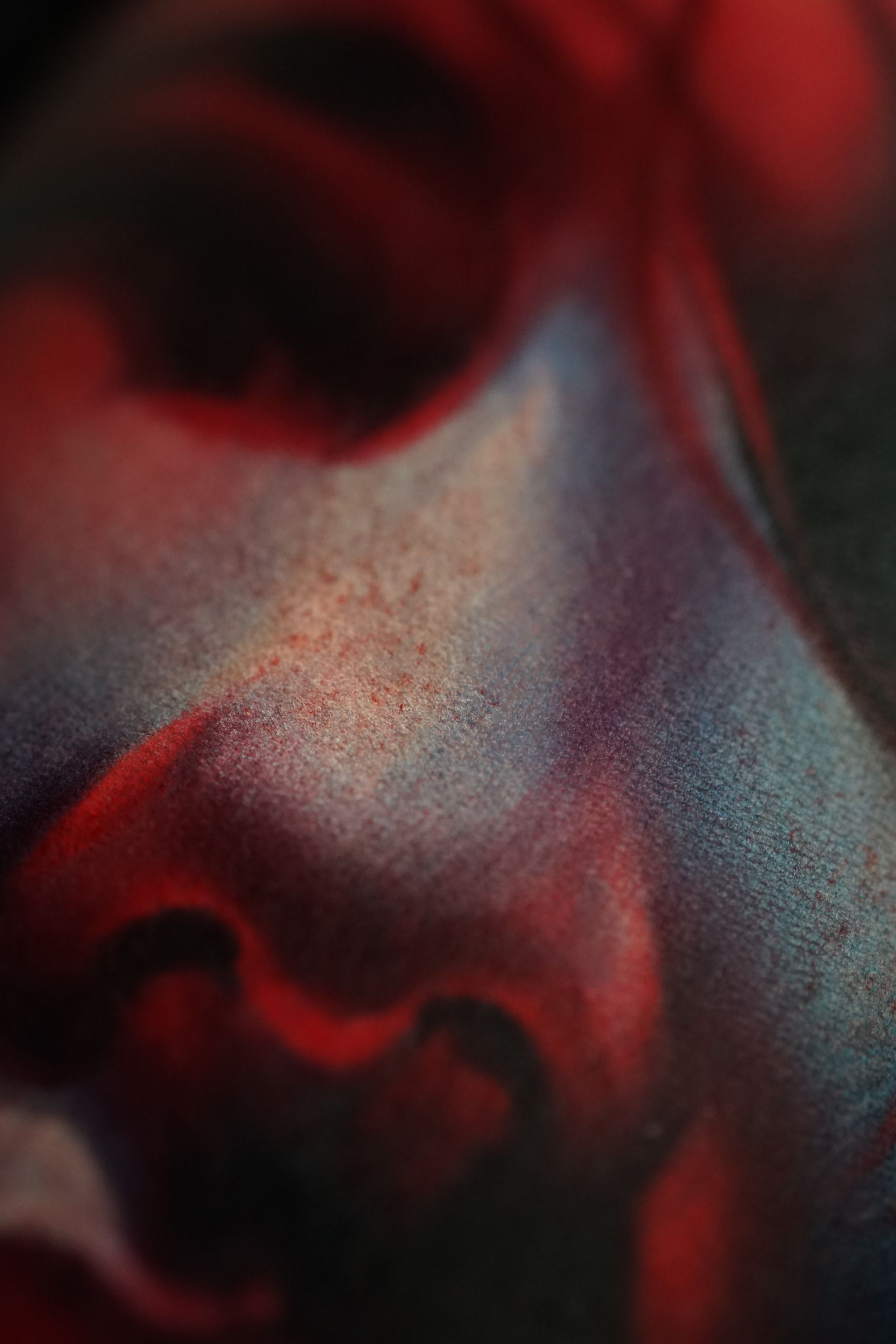 A close up of a person 's face with red paint on it.