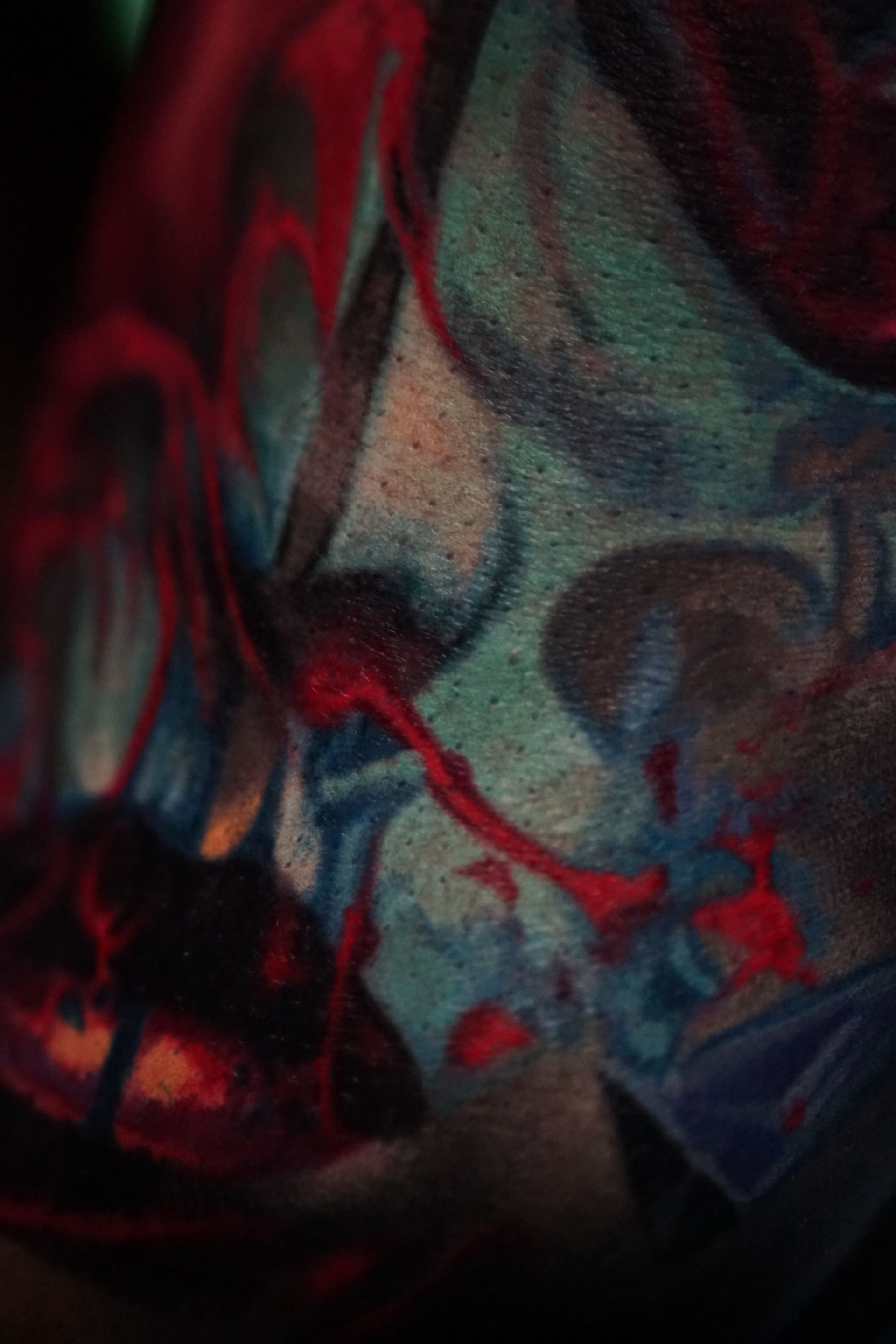 A close up of a tattoo on a person 's face.