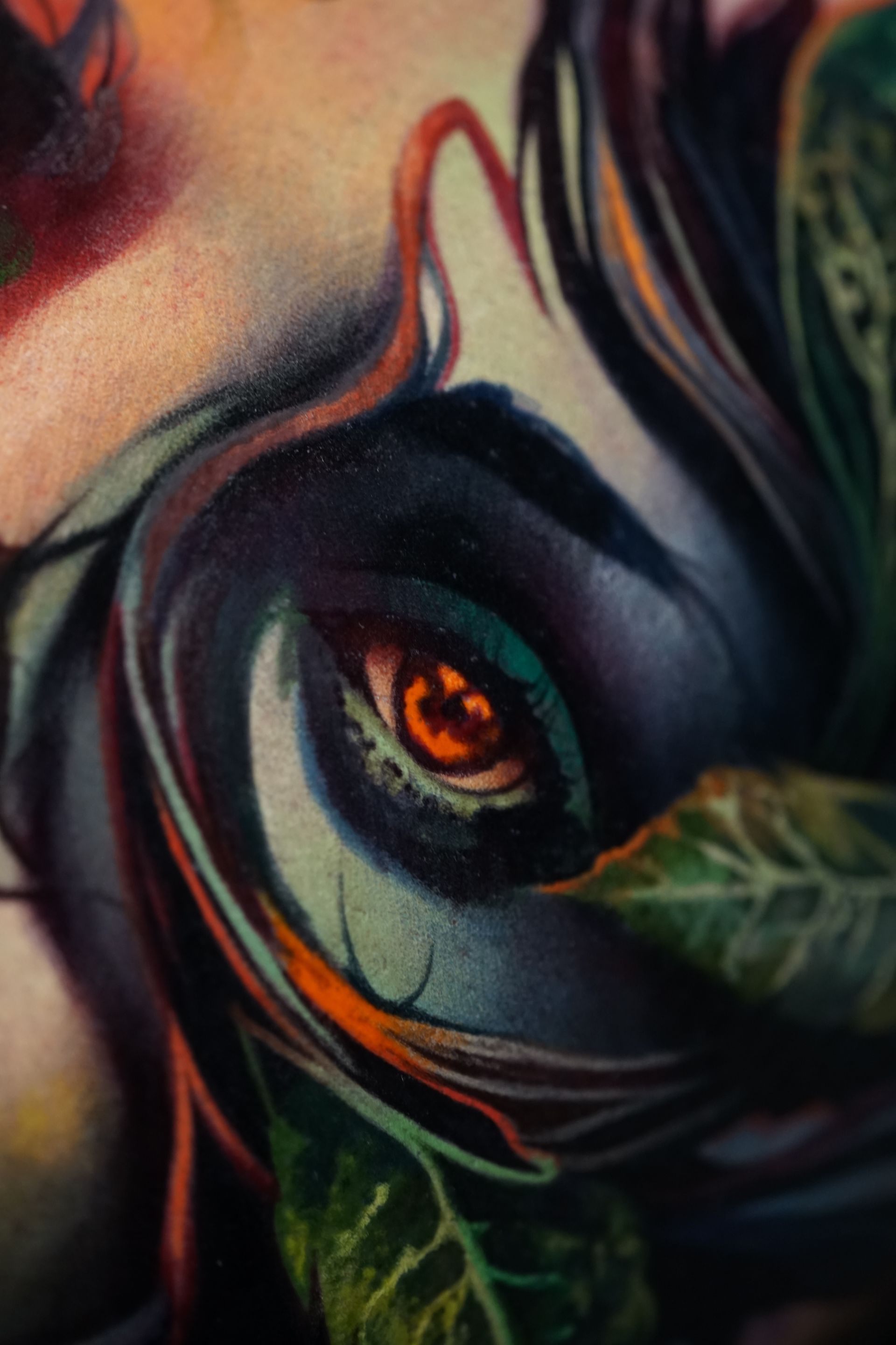 A close up of a painting of a woman 's eye
