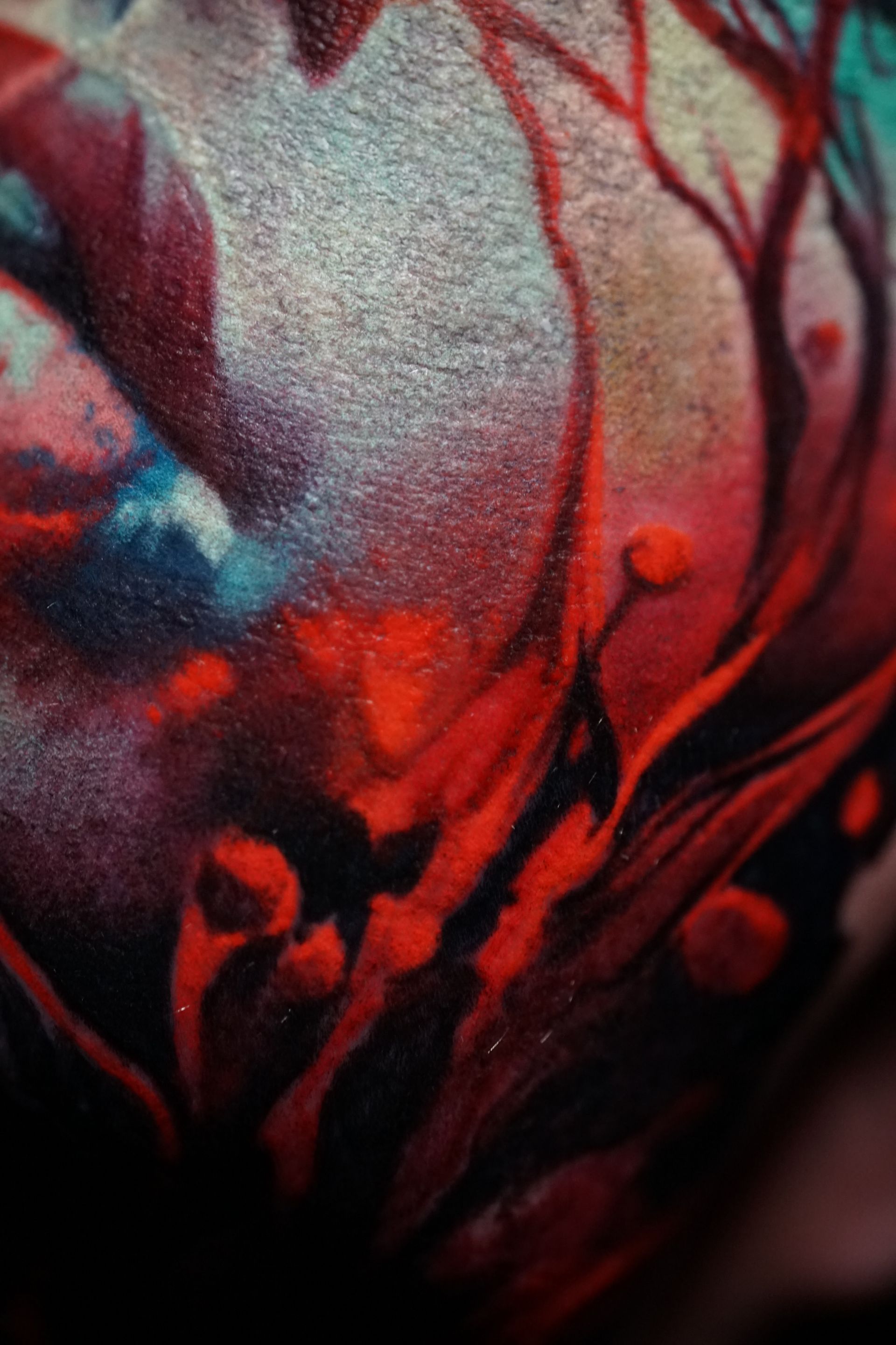 A close up of a colorful tattoo on a person 's arm.