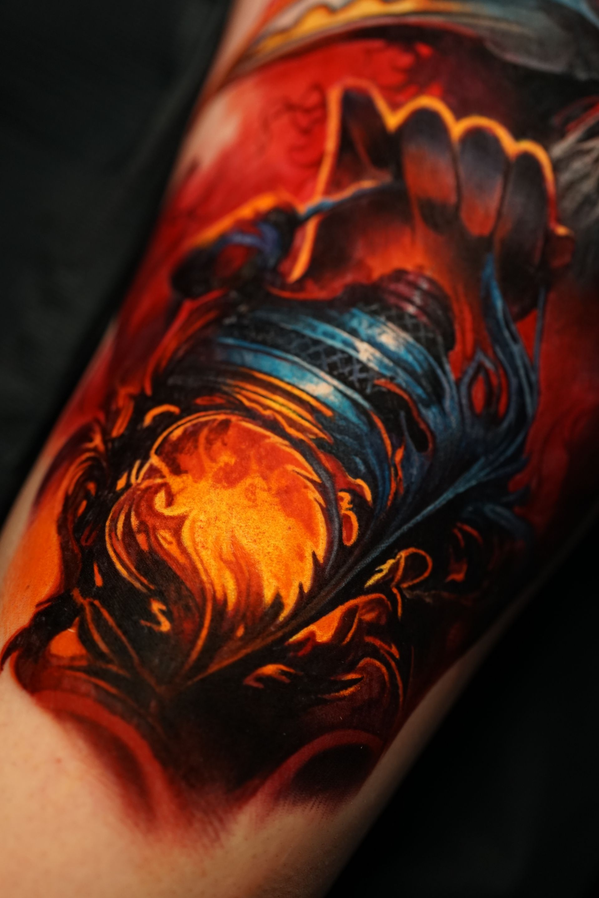 A close up of a colorful tattoo on a person 's arm.