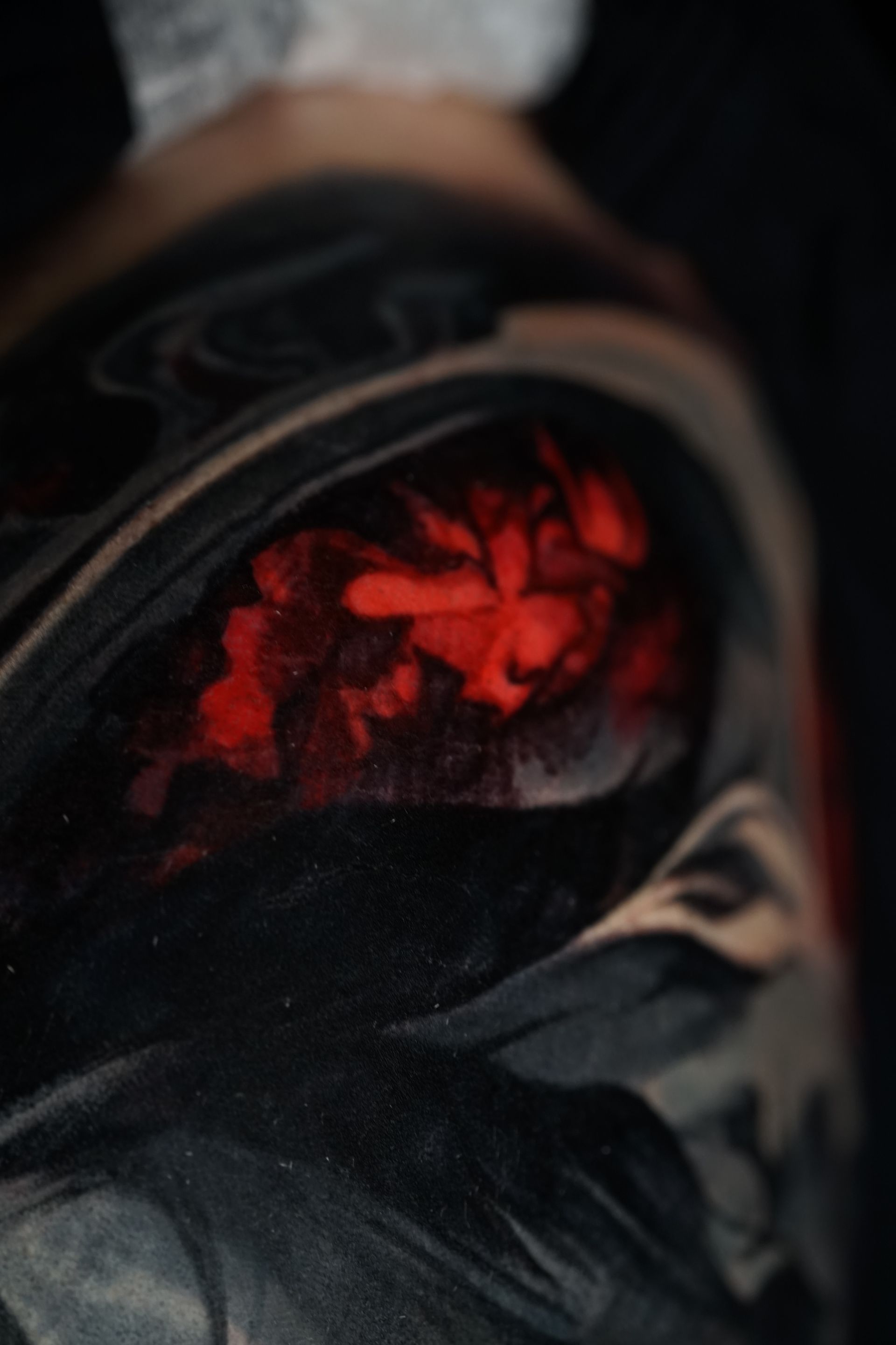 A close up of a black object with a red light coming out of it