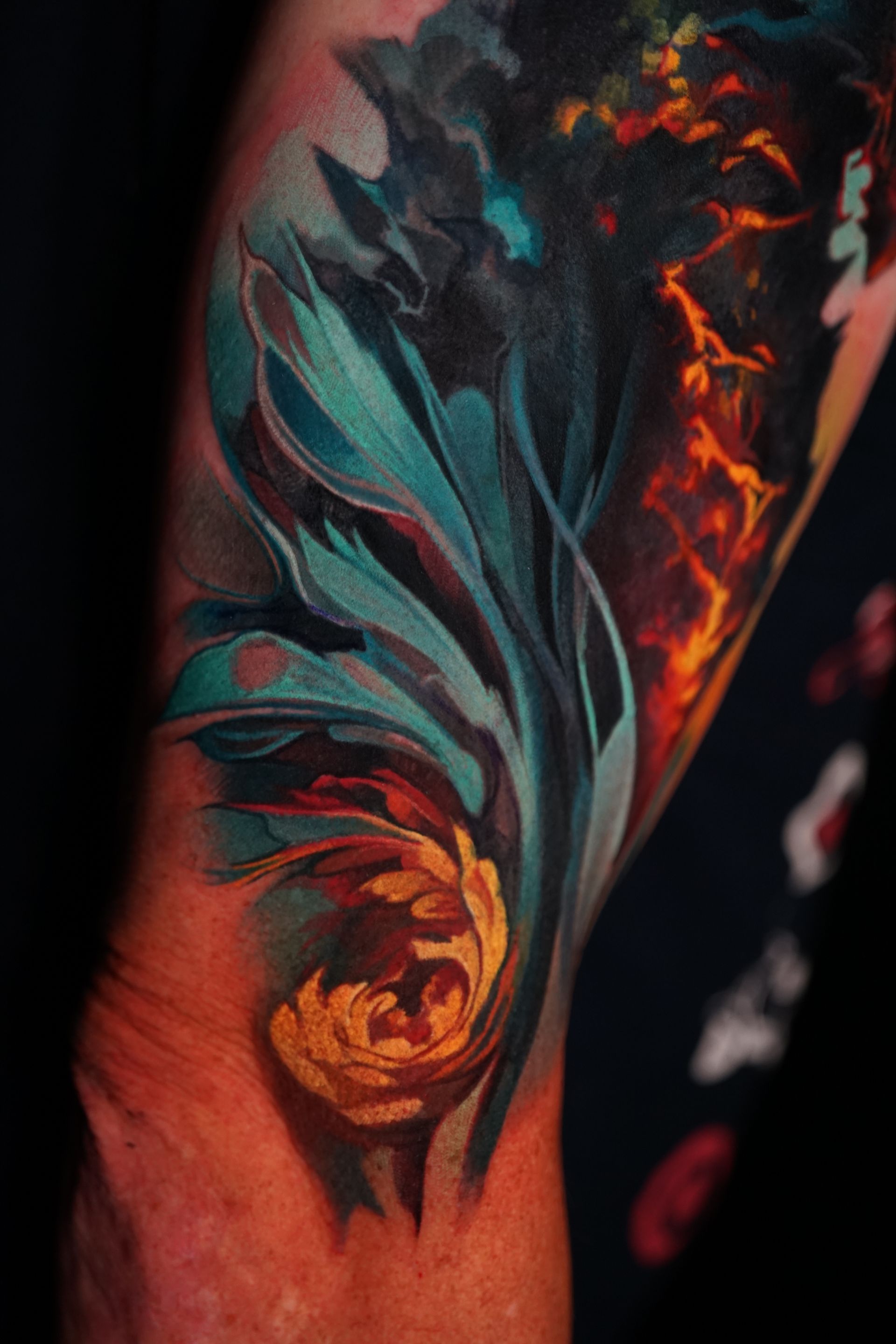 A close up of a colorful tattoo on a person 's arm.