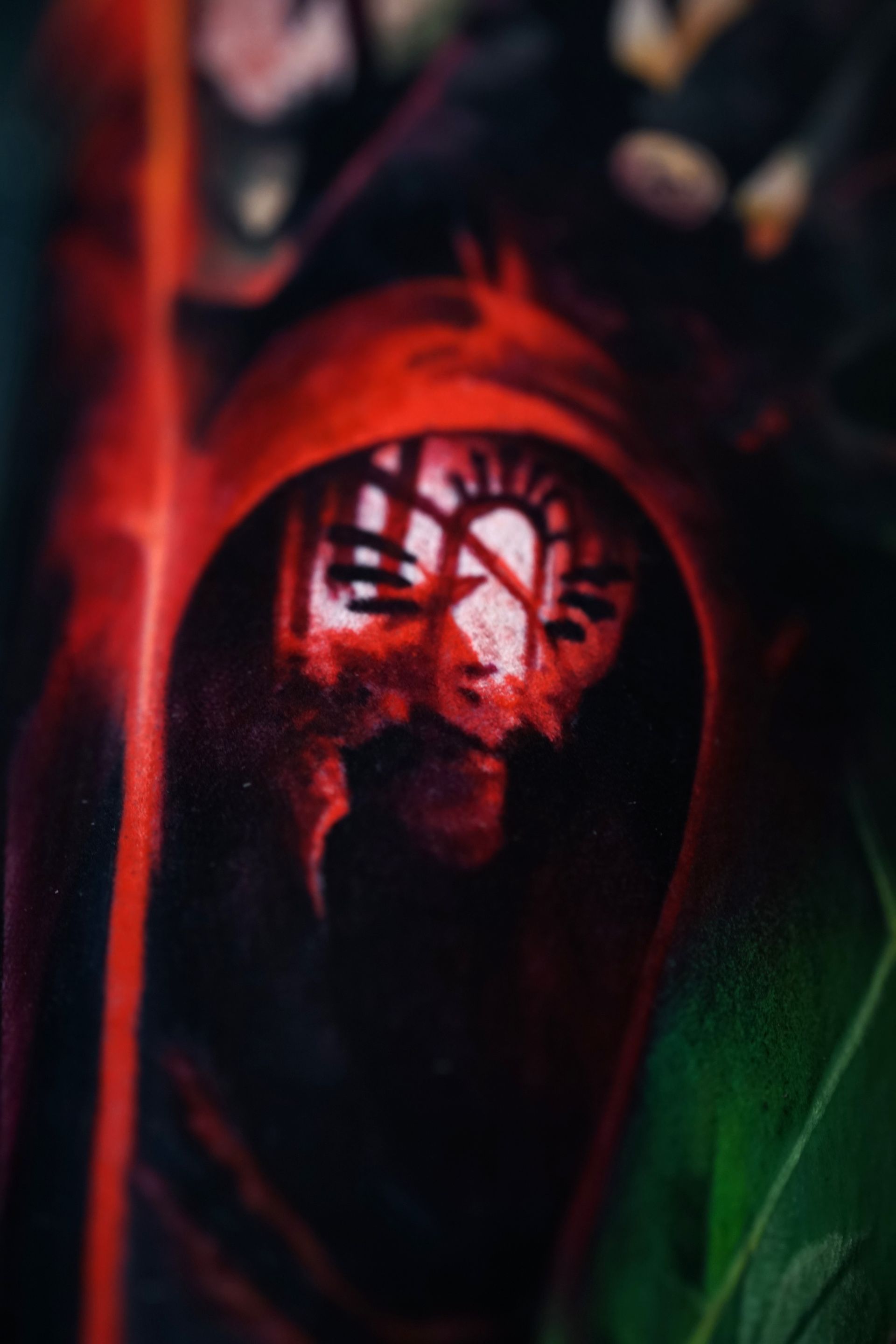 A close up of a red object with a face in it