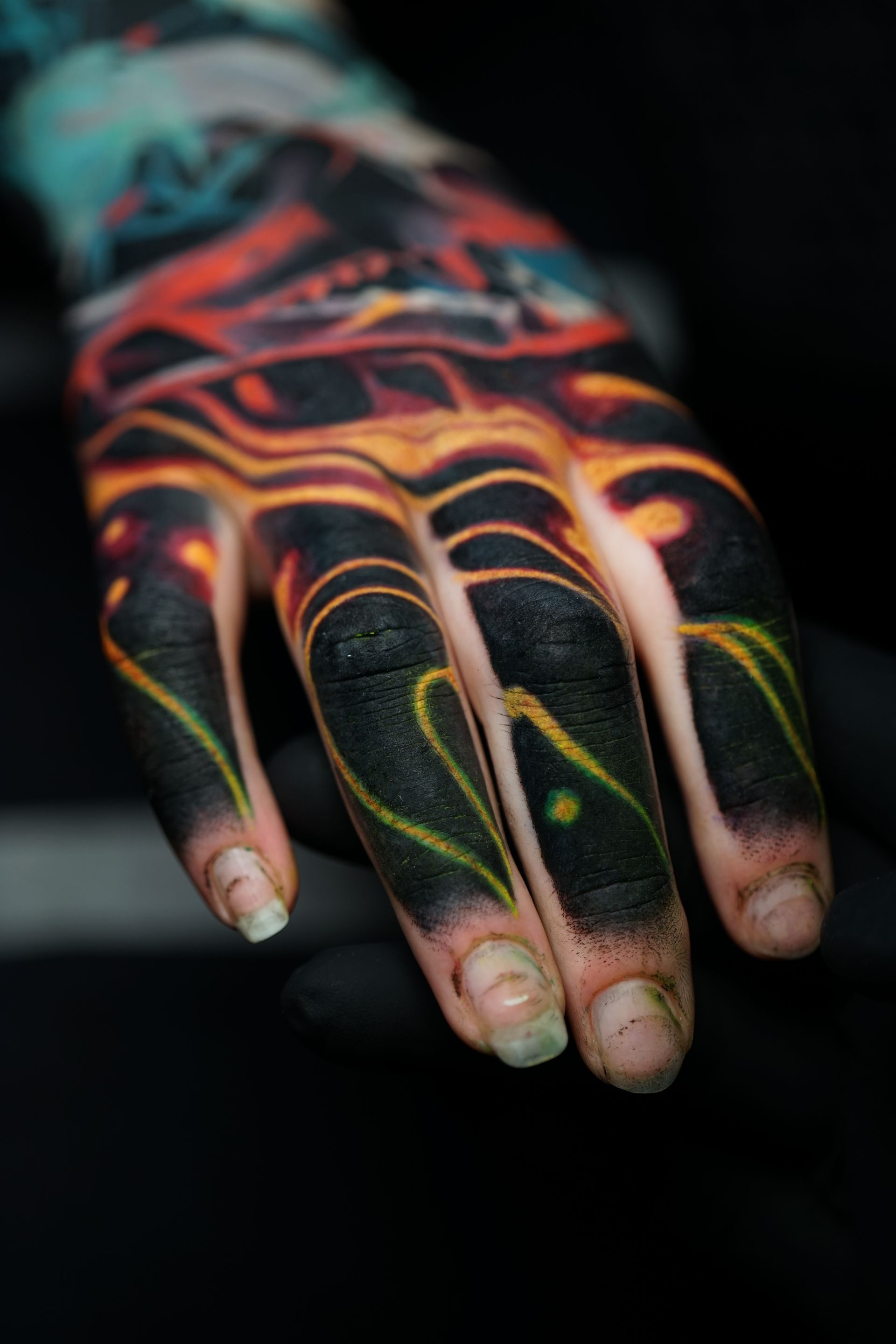 A close up of a person 's hand with a tattoo on it.