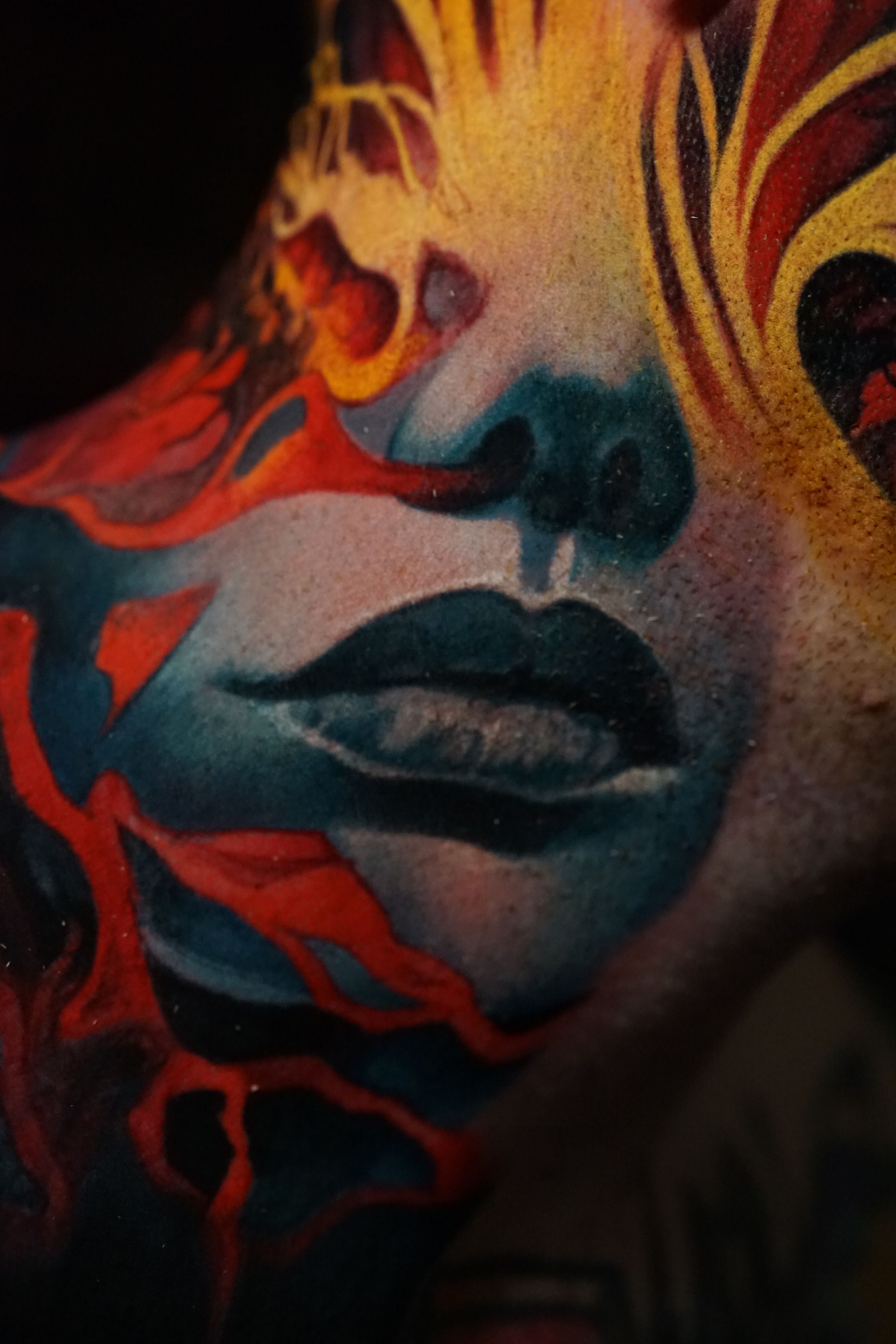 A close up of a painting of a woman 's face