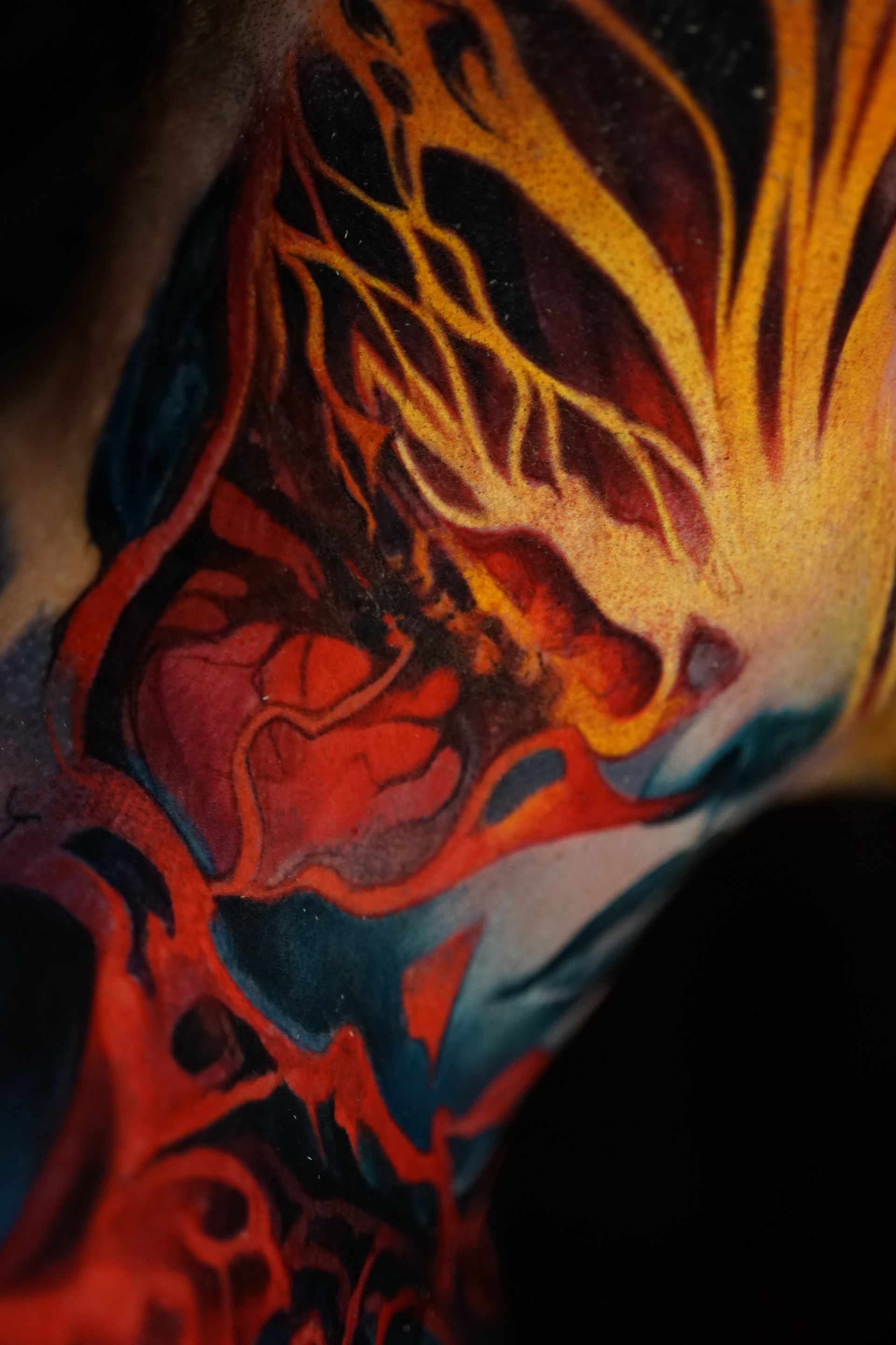 A close up of a colorful tattoo on a person 's arm.